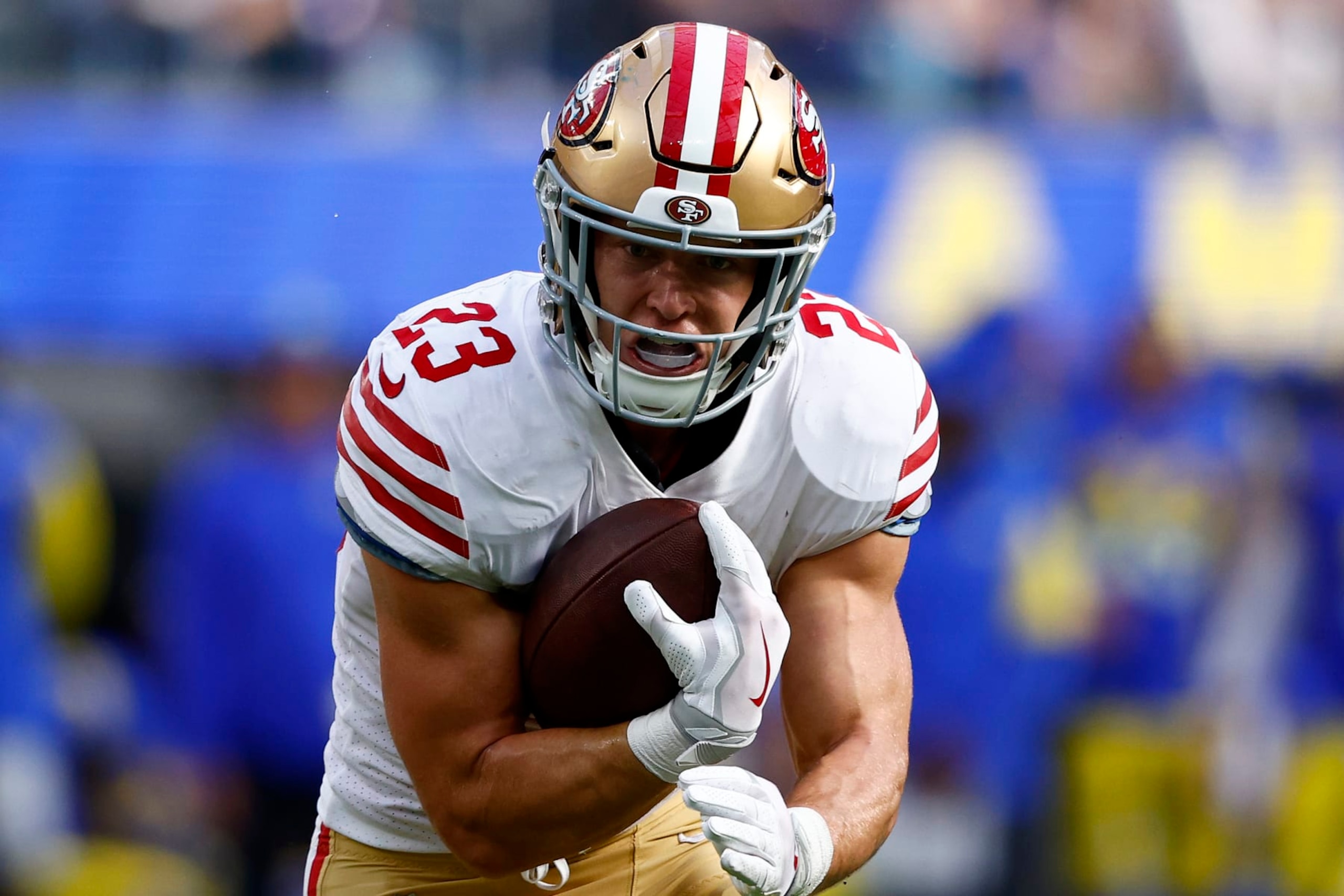 INGLEWOOD, CALIFORNIA - OCTOBER 30: Christian McCaffrey #23 of the San Francisco 49ers runs with the ball during the second quarter against the Los Angeles Rams at SoFi Stadium on October 30, 2022 in Inglewood, California. (Photo by Ronald Martinez/Getty Images) INGLEWOOD, CALIFORNIA - OCTOBER 30: Christian McCaffrey #23 of the San Francisco 49ers runs with the ball during the second quarter against the Los Angeles Rams at SoFi Stadium on October 30, 2022 in Inglewood, California. (Photo by Ronald Martinez/Getty Images)