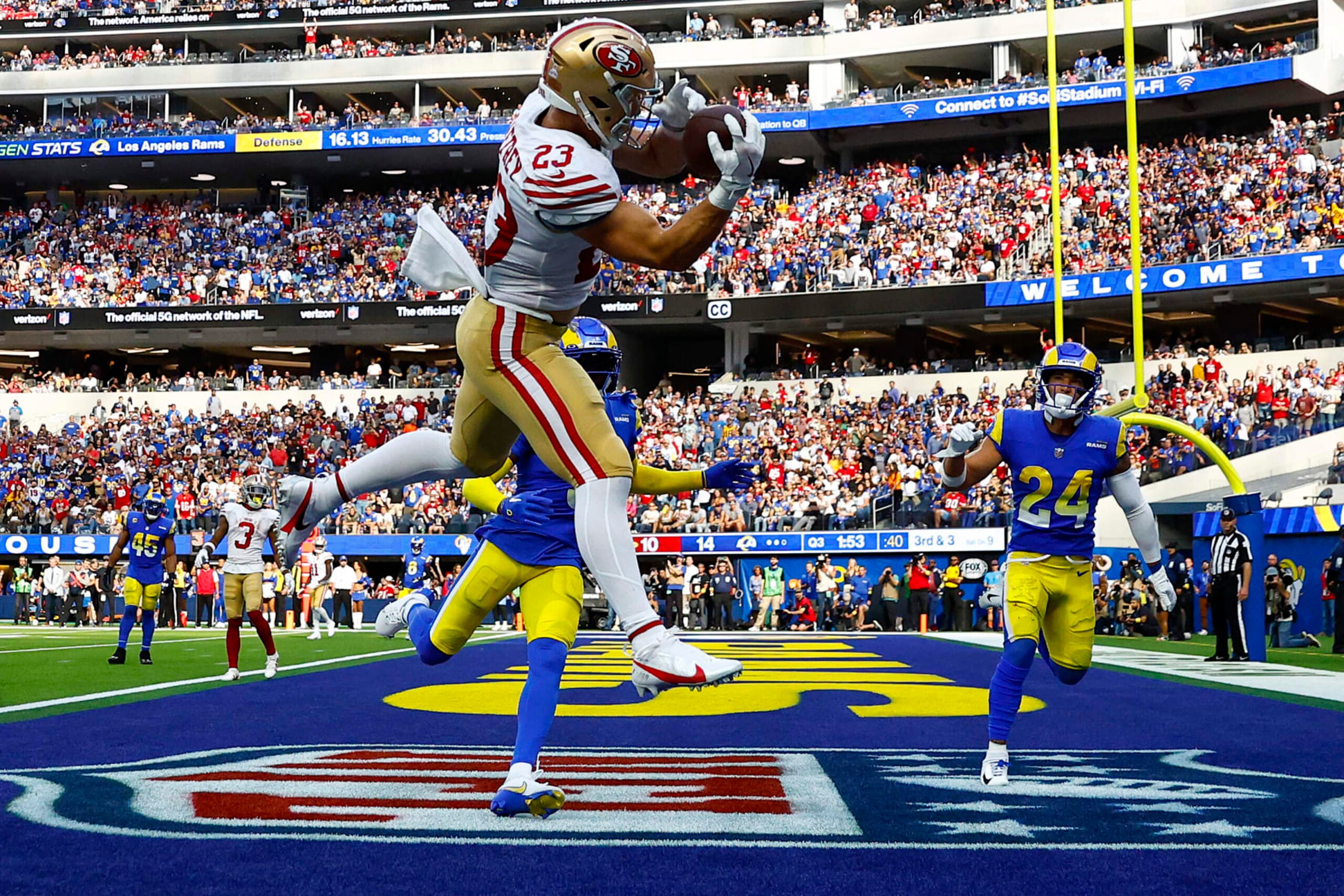 INGLEWOOD, CALIFORNIA - OCTOBER 30: Christian McCaffrey #23 of the San Francisco 49ers catches the ball for a touchdown as Jalen Ramsey #5 and Taylor Rapp #24 of the Los Angeles Rams defend during the third quarter at SoFi Stadium on October 30, 2022 in Inglewood, California. (Photo by Ronald Martinez/Getty Images) INGLEWOOD, CALIFORNIA - OCTOBER 30: Christian McCaffrey #23 of the San Francisco 49ers catches the ball for a touchdown as Jalen Ramsey #5 and Taylor Rapp #24 of the Los Angeles Rams defend during the third quarter at SoFi Stadium on October 30, 2022 in Inglewood, California. (Photo by Ronald Martinez/Getty Images)