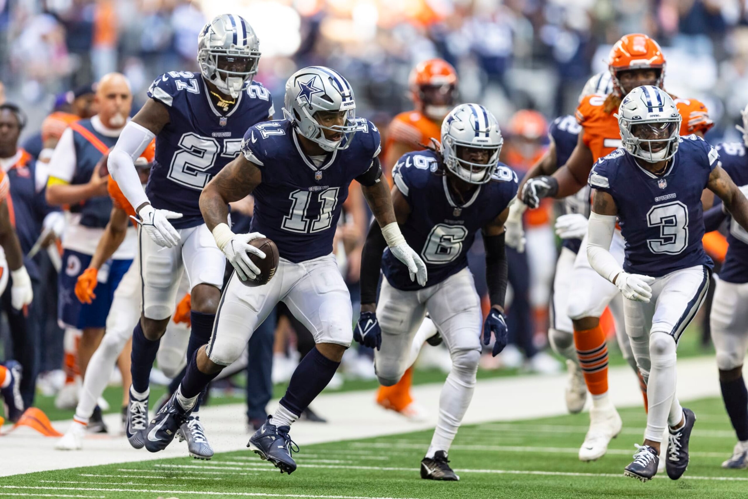 Dallas Cowboys linebacker Micah Parsons (11) recovers a Chicago Bears fumble during the second half of an NFL football game, Sunday, Oct. 30, 2022, in Arlington, Texas. Parsons would run the ball for a touchdown on the play. Dallas won 49-29. (AP Photo/Brandon Wade)