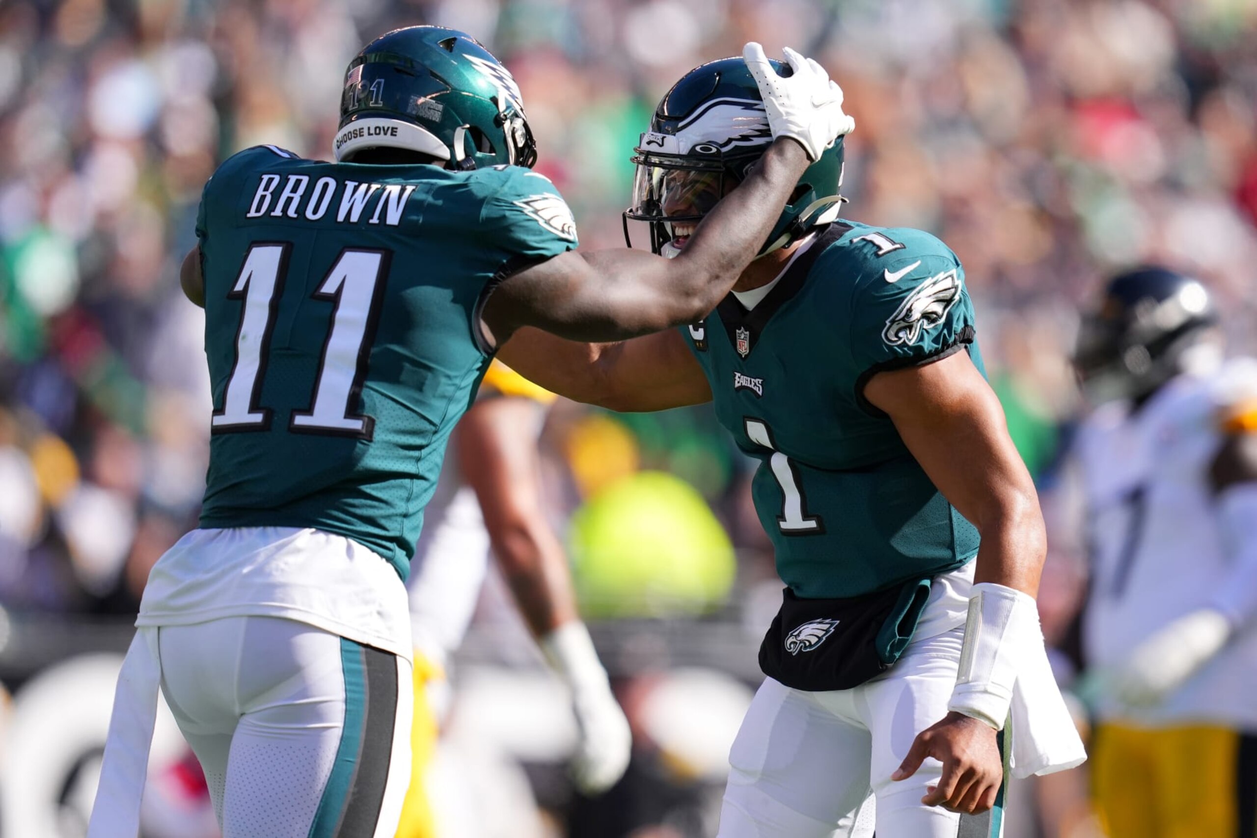 PHILADELPHIA, PENNSYLVANIA - OCTOBER 30: A.J. Brown #11 of the Philadelphia Eagles celebrates with Jalen Hurts #1 of the Philadelphia Eagles after Brown caught his third touchdown in the second quarter of game against the Pittsburgh Steelers at Lincoln Financial Field on October 30, 2022 in Philadelphia, Pennsylvania. (Photo by Mitchell Leff/Getty Images)