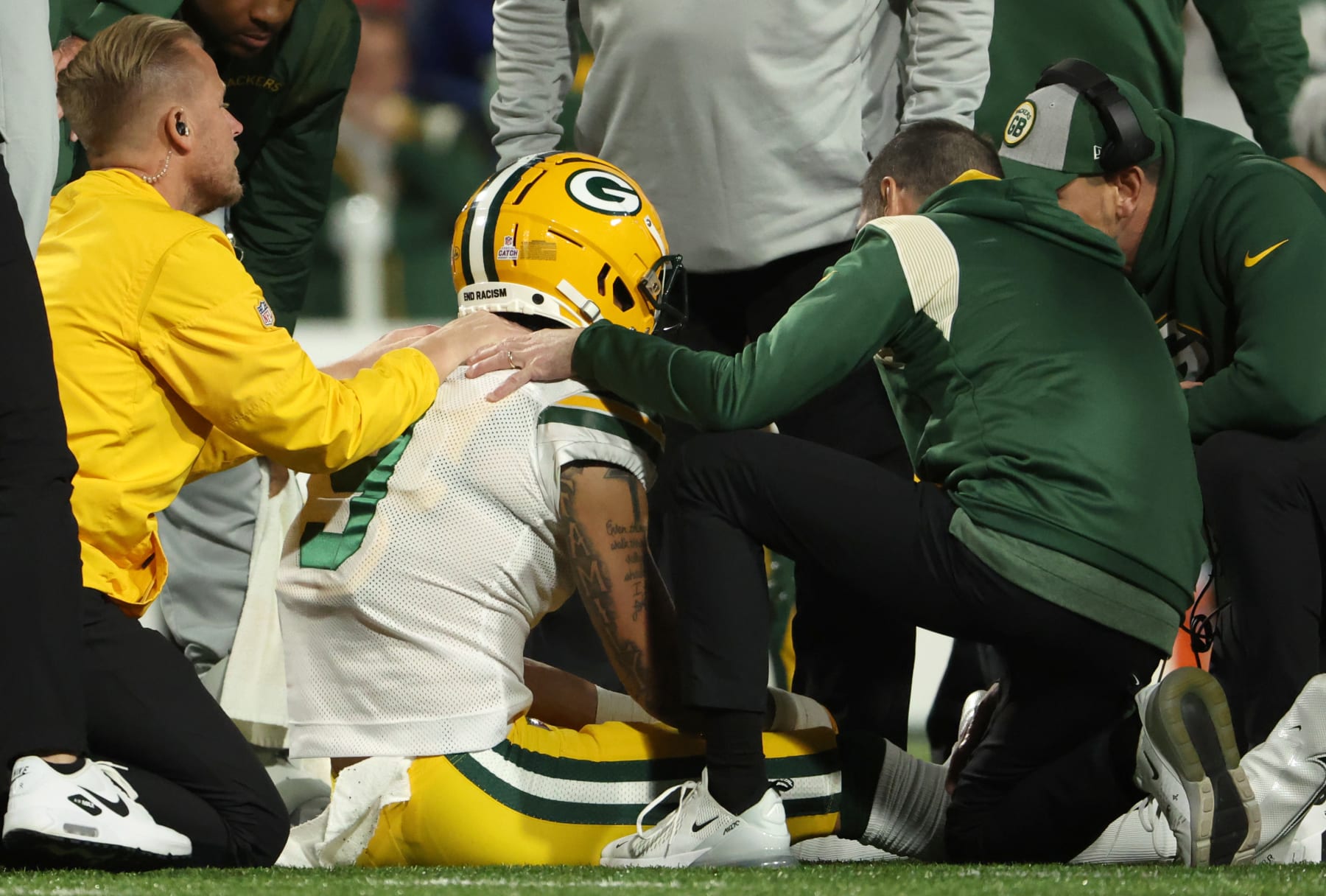 ORCHARD PARK, NEW YORK - OCTOBER 30: Christian Watson #9 of the Green Bay Packers receives attention after suffering an injury during the first half against the Buffalo Bills at Highmark Stadium on October 30, 2022 in Orchard Park, New York. (Photo by Timothy T Ludwig/Getty Images)