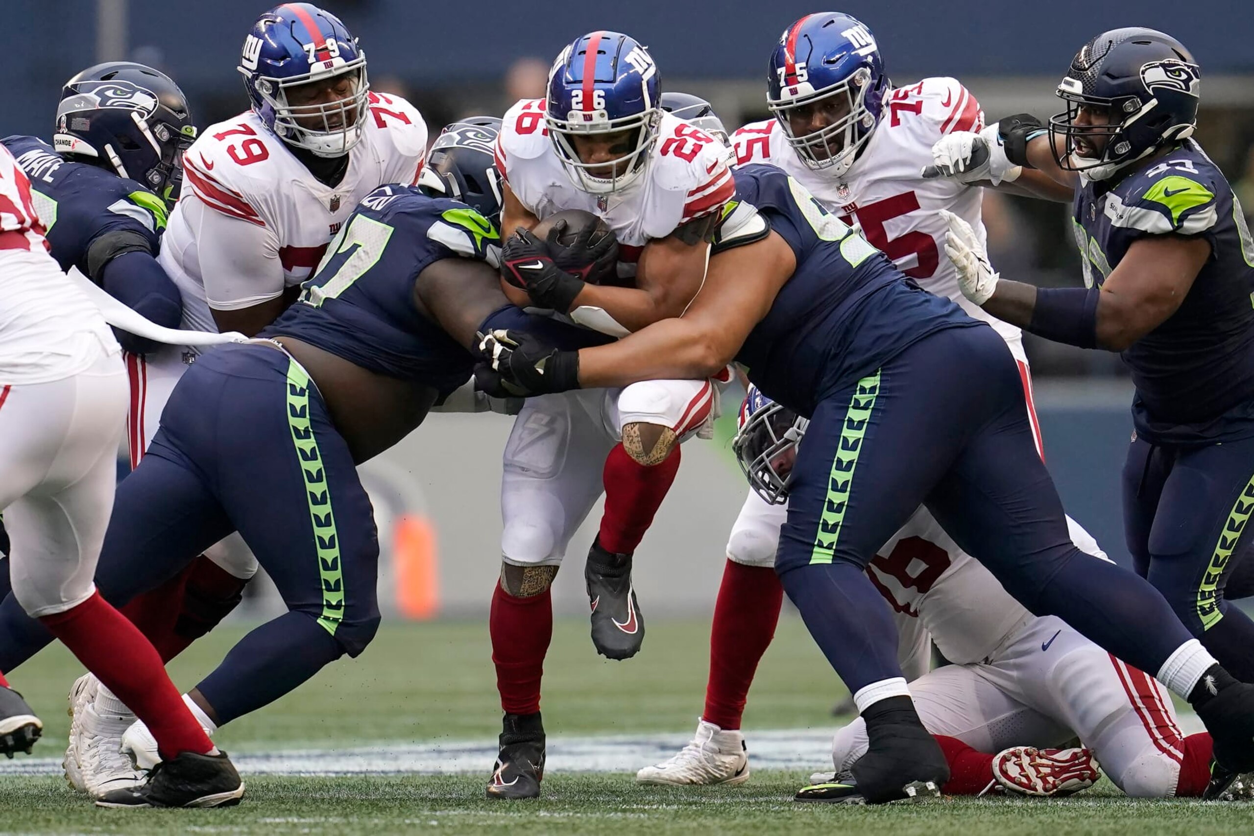 New York Giants running back Saquon Barkley (26) runs against the Seattle Seahawks during the second half of an NFL football game in Seattle, Sunday, Oct. 30, 2022. (AP Photo/Marcio Jose Sanchez)