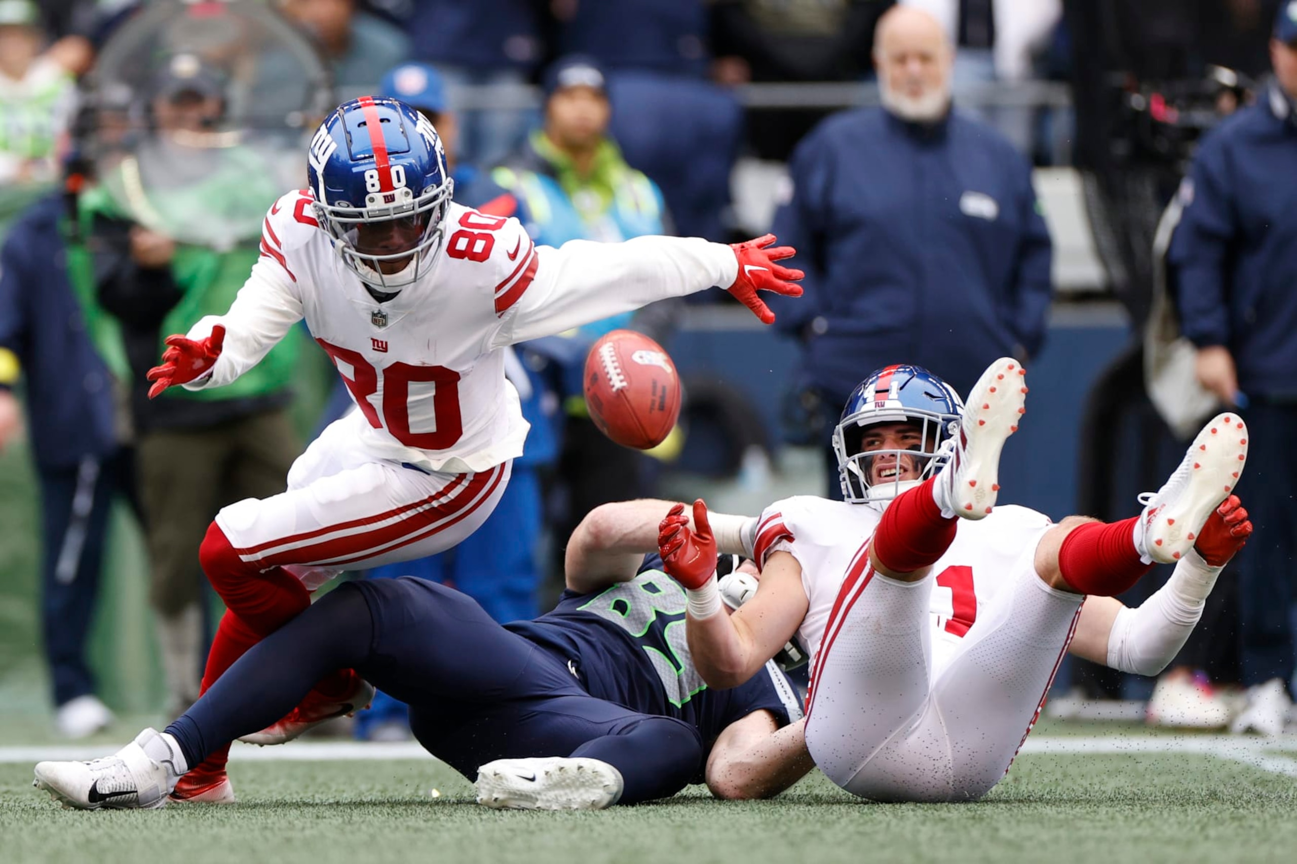 SEATTLE, WASHINGTON - OCTOBER 30: Richie James #80 of the New York Giants fumbles the ball against the Seattle Seahawks during the second quarter at Lumen Field on October 30, 2022 in Seattle, Washington. (Photo by Steph Chambers/Getty Images)