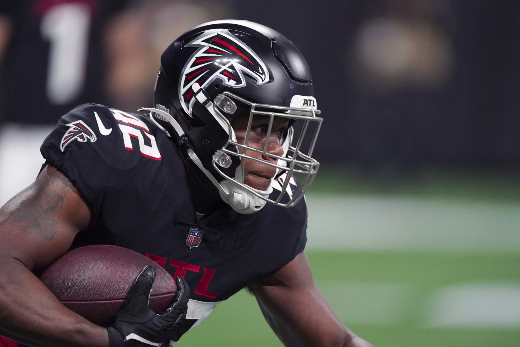 Atlanta Falcons running back Caleb Huntley runs with the ball during the first half of an NFL football game against the Carolina Panthers Sunday, Oct. 30, 2022, in Atlanta. (AP Photo/John Bazemore)