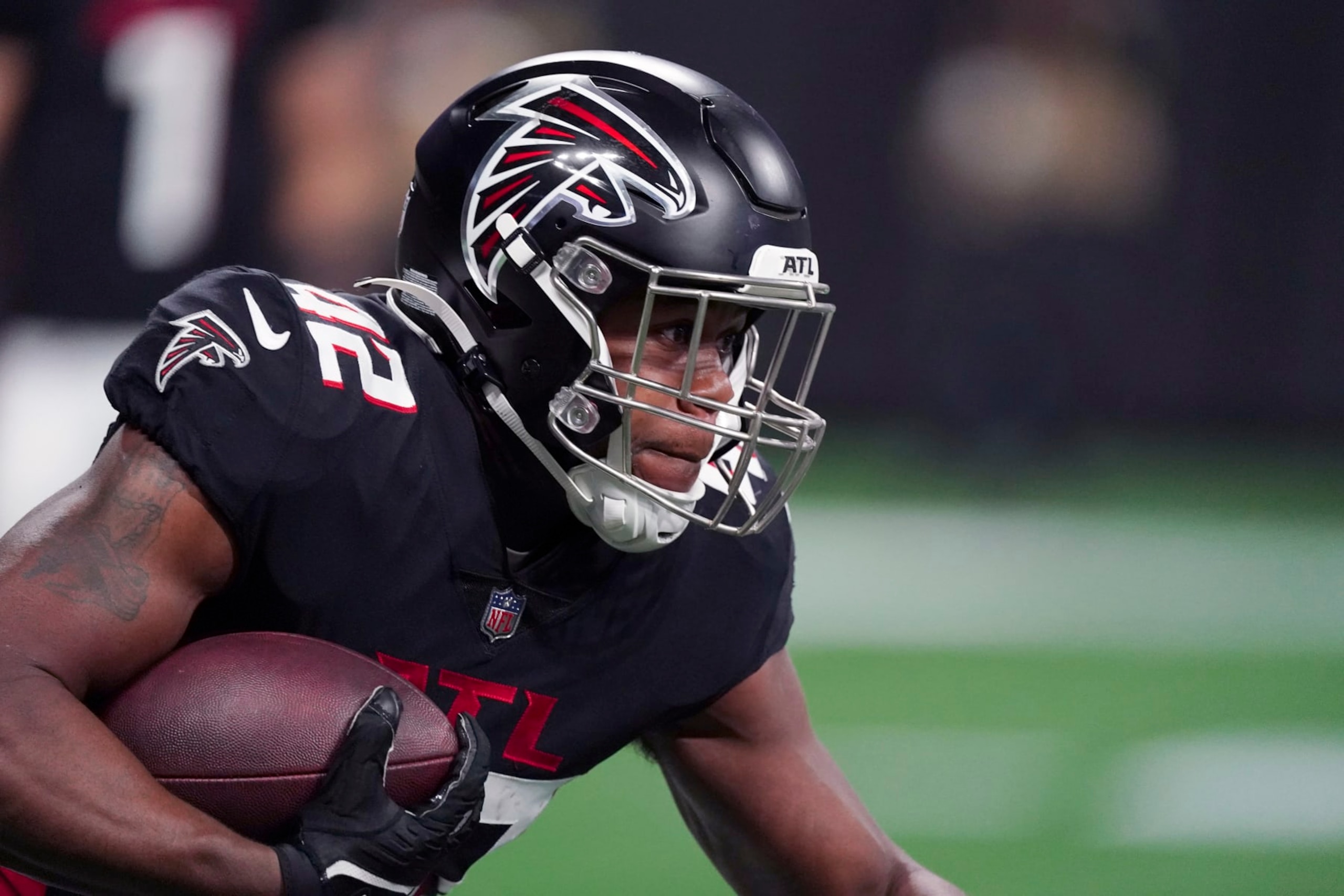 Atlanta Falcons running back Caleb Huntley runs with the ball during the first half of an NFL football game against the Carolina Panthers Sunday, Oct. 30, 2022, in Atlanta. (AP Photo/John Bazemore)