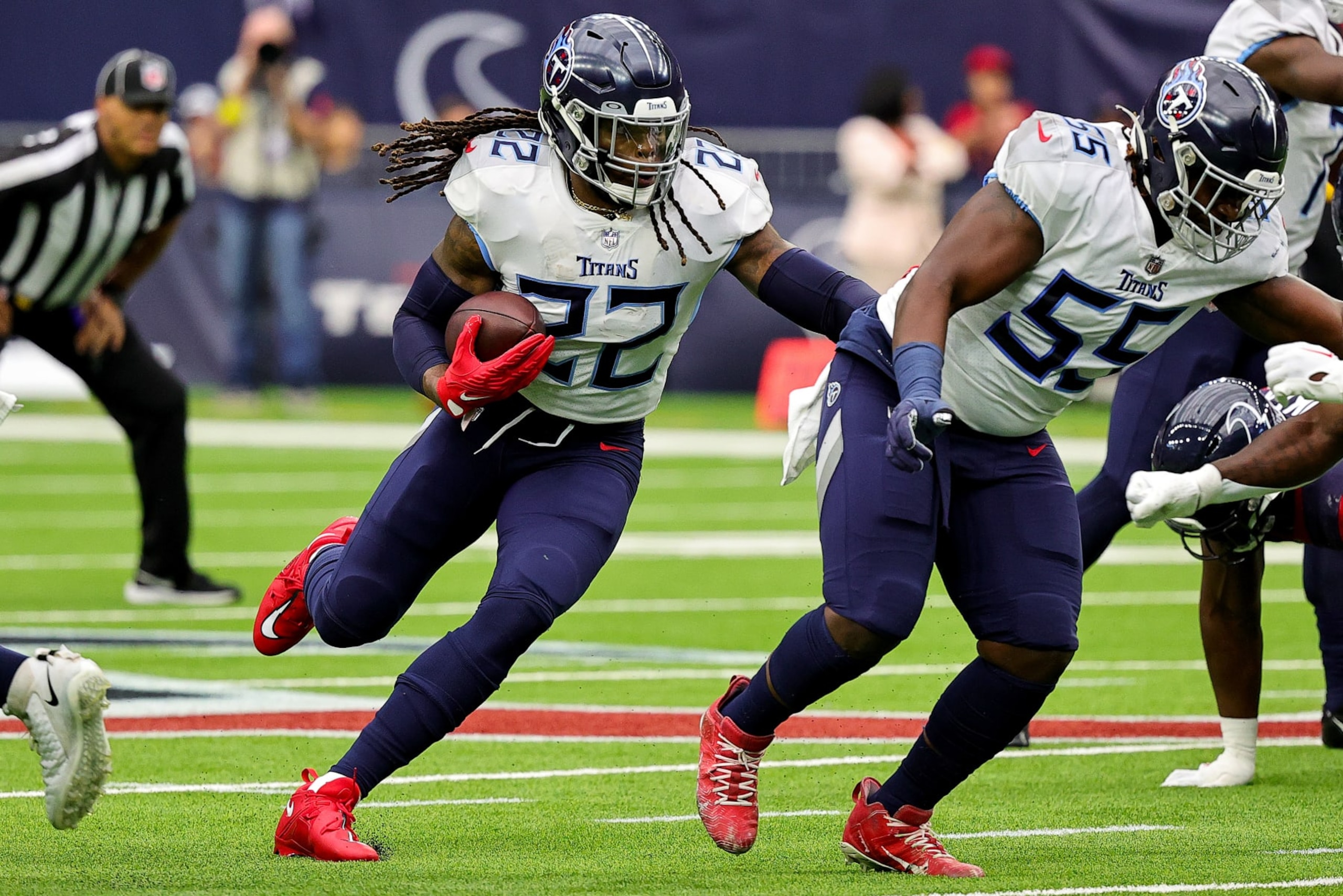 HOUSTON, TEXAS - OCTOBER 30: Derrick Henry #22 of the Tennessee Titans runs with the ball during the first quarter against the Houston Texans at NRG Stadium on October 30, 2022 in Houston, Texas. (Photo by Bob Levey/Getty Images)