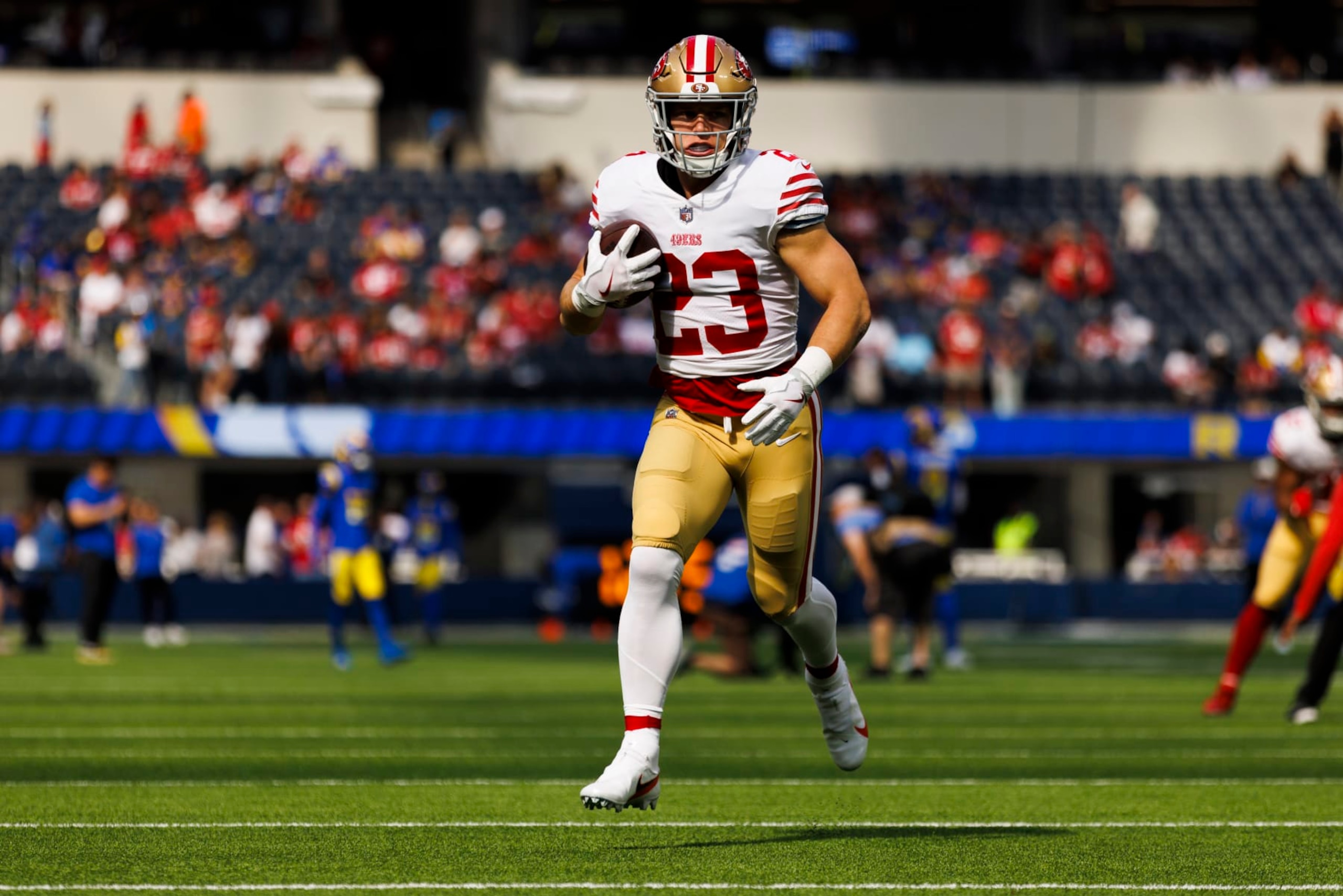 INGLEWOOD, CA - OCTOBER 30: San Francisco 49ers running back Christian McCaffrey (23) runs with the ball during an NFL football game between the San Francisco 49ers and the Los Angeles Rams on October 30, 2022 at SoFi Stadium in Inglewood, CA. (Photo by Ric Tapia/Icon Sportswire via Getty Images)