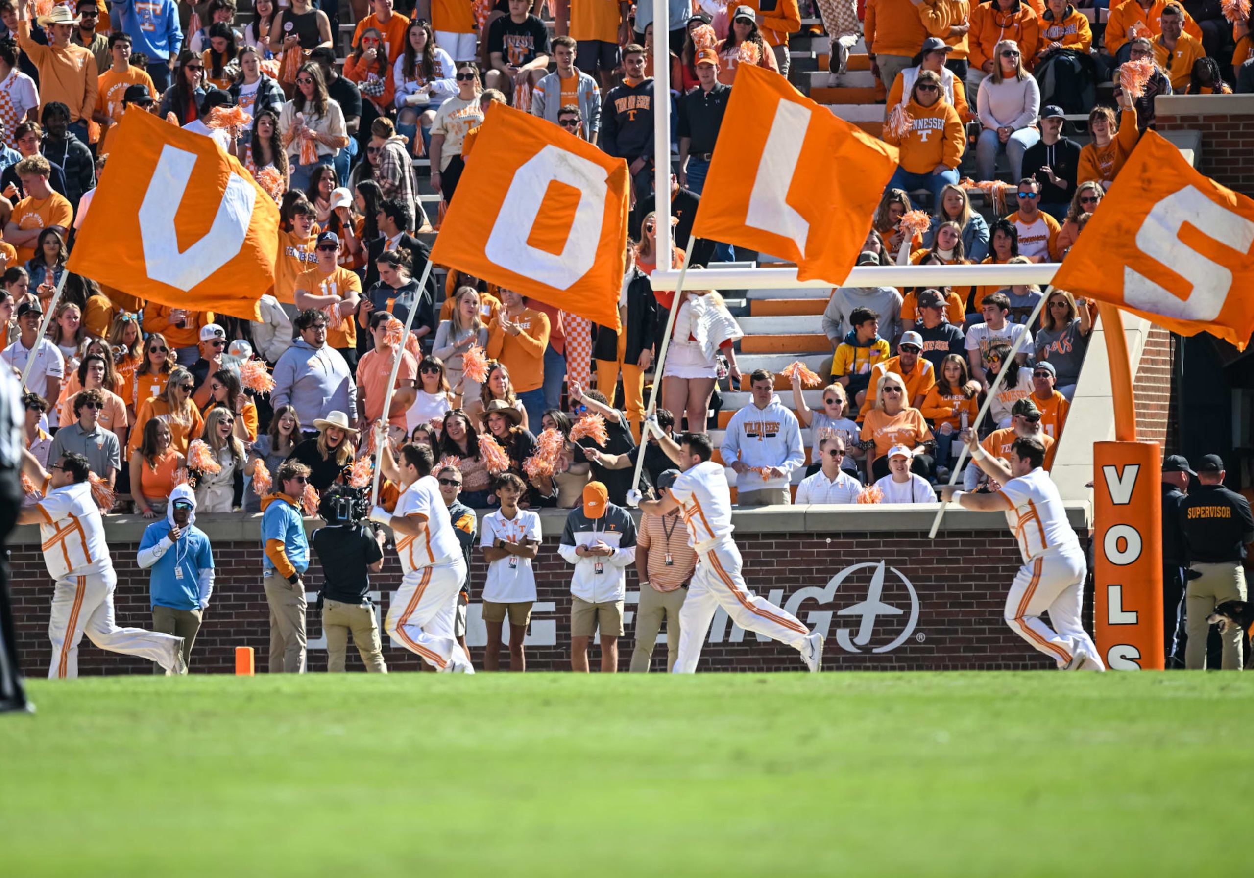 KNOXVILLE, TN - OCTOBER 22: Tennessee Volunteers cheerleaders run the VOLS flags across the end zone during the college football game between the Tennessee Volunteers and Tennessee Martin Skyhawks on October 22, 2022 at Neyland Stadium in Knoxville, TN. (Photo by Bryan Lynn/Icon Sportswire via Getty Images) KNOXVILLE, TN - OCTOBER 22: Tennessee Volunteers cheerleaders run the VOLS flags across the end zone during the college football game between the Tennessee Volunteers and Tennessee Martin Skyhawks on October 22, 2022 at Neyland Stadium in Knoxville, TN. (Photo by Bryan Lynn/Icon Sportswire via Getty Images)