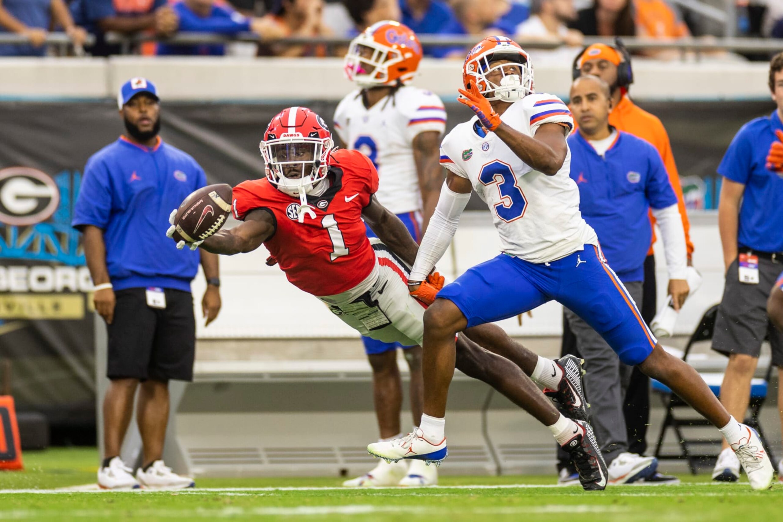 JACKSONVILLE, FLORIDA - OCTOBER 29: Marcus Rosemy-Jacksaint #1 of the Georgia Bulldogs attempts to catch a pass during the first half of a game against Jason Marshall Jr. #3 of the Florida Gators at TIAA Bank Field on October 29, 2022 in Jacksonville, Florida. (Photo by James Gilbert/Getty Images) JACKSONVILLE, FLORIDA - OCTOBER 29: Marcus Rosemy-Jacksaint #1 of the Georgia Bulldogs attempts to catch a pass during the first half of a game against Jason Marshall Jr. #3 of the Florida Gators at TIAA Bank Field on October 29, 2022 in Jacksonville, Florida. (Photo by James Gilbert/Getty Images)