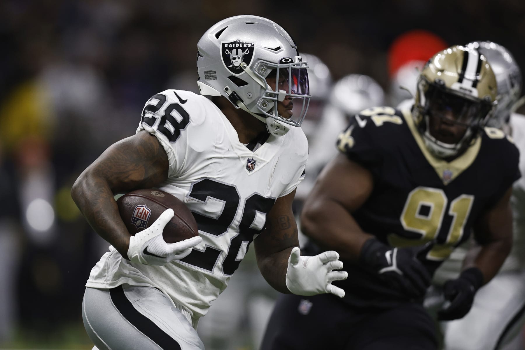 NEW ORLEANS, LOUISIANA - OCTOBER 30: Josh Jacobs #28 of the Las Vegas Raiders runs with the ball during the first quarter of a game against the New Orleans Saints at Caesars Superdome on October 30, 2022 in New Orleans, Louisiana. (Photo by Sean Gardner/Getty Images)