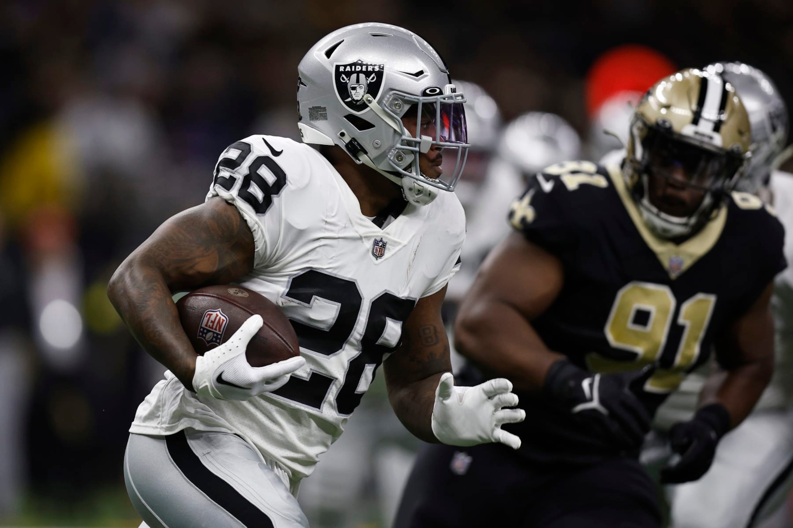NEW ORLEANS, LOUISIANA - OCTOBER 30: Josh Jacobs #28 of the Las Vegas Raiders runs with the ball during the first quarter of a game against the New Orleans Saints at Caesars Superdome on October 30, 2022 in New Orleans, Louisiana. (Photo by Sean Gardner/Getty Images) NEW ORLEANS, LOUISIANA - OCTOBER 30: Josh Jacobs #28 of the Las Vegas Raiders runs with the ball during the first quarter of a game against the New Orleans Saints at Caesars Superdome on October 30, 2022 in New Orleans, Louisiana. (Photo by Sean Gardner/Getty Images)