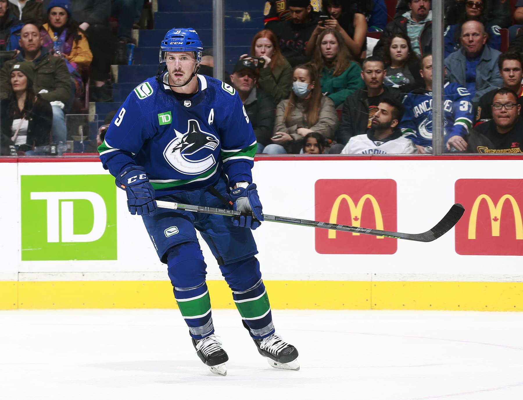 VANCOUVER, CANADA - OCTOBER 24: J.T. Miller #9 of the Vancouver Canucks skates up ice during their NHL game against the Carolina Hurricanes at Rogers Arena October 24, 2022 in Vancouver, British Columbia, Canada.  (Photo by Jeff Vinnick/NHLI via Getty Images)