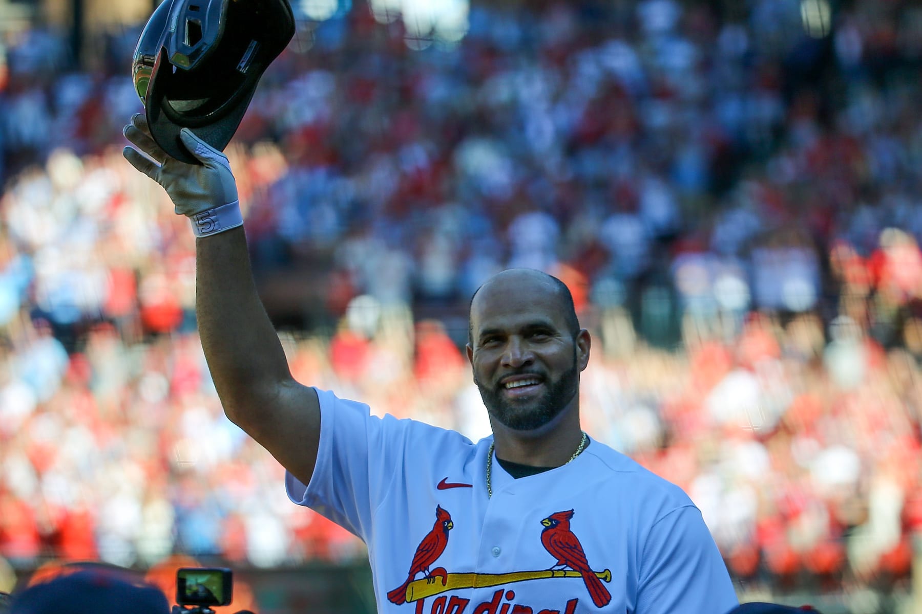 ST. LOUIS, MO - OCTOBER 02: Albert Pujols #5 of the St. Louis Cardinals salutes fans after hitting a solo home run during the third inning against the Pittsburgh Pirates at Busch Stadium on October 2, 2022 in St. Louis, Missouri. (Photo by Scott Kane/Getty Images)