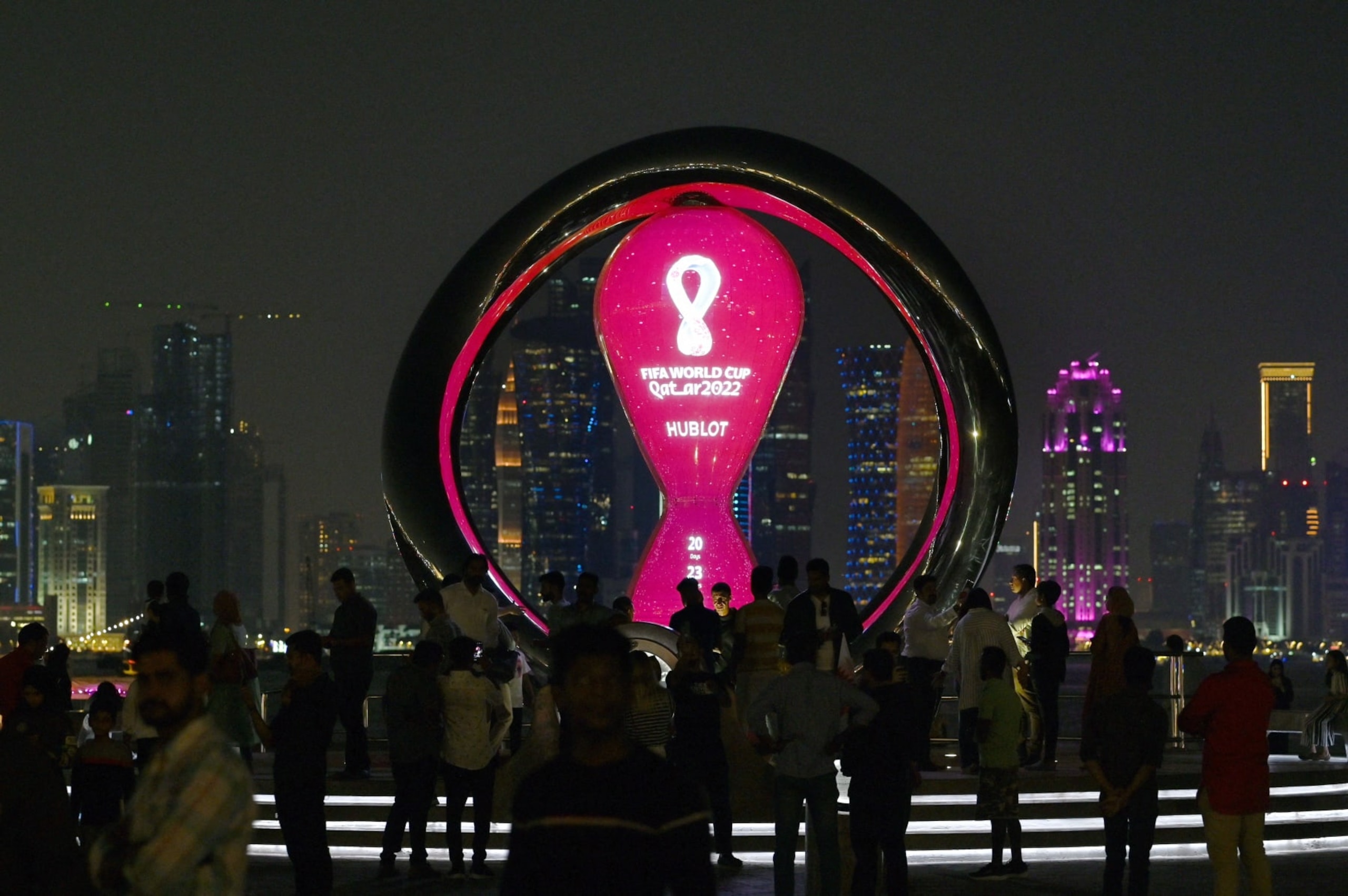 Visitors take photos of the 2022 FIFA World Cup countdown clock on the Corniche in Doha on October 30, 2022, ahead of the Qatar 2022 FIFA World Cup football tournament. (Photo by GABRIEL BOUYS / AFP) (Photo by GABRIEL BOUYS/AFP via Getty Images) Visitors take photos of the 2022 FIFA World Cup countdown clock on the Corniche in Doha on October 30, 2022, ahead of the Qatar 2022 FIFA World Cup football tournament. (Photo by GABRIEL BOUYS / AFP) (Photo by GABRIEL BOUYS/AFP via Getty Images)