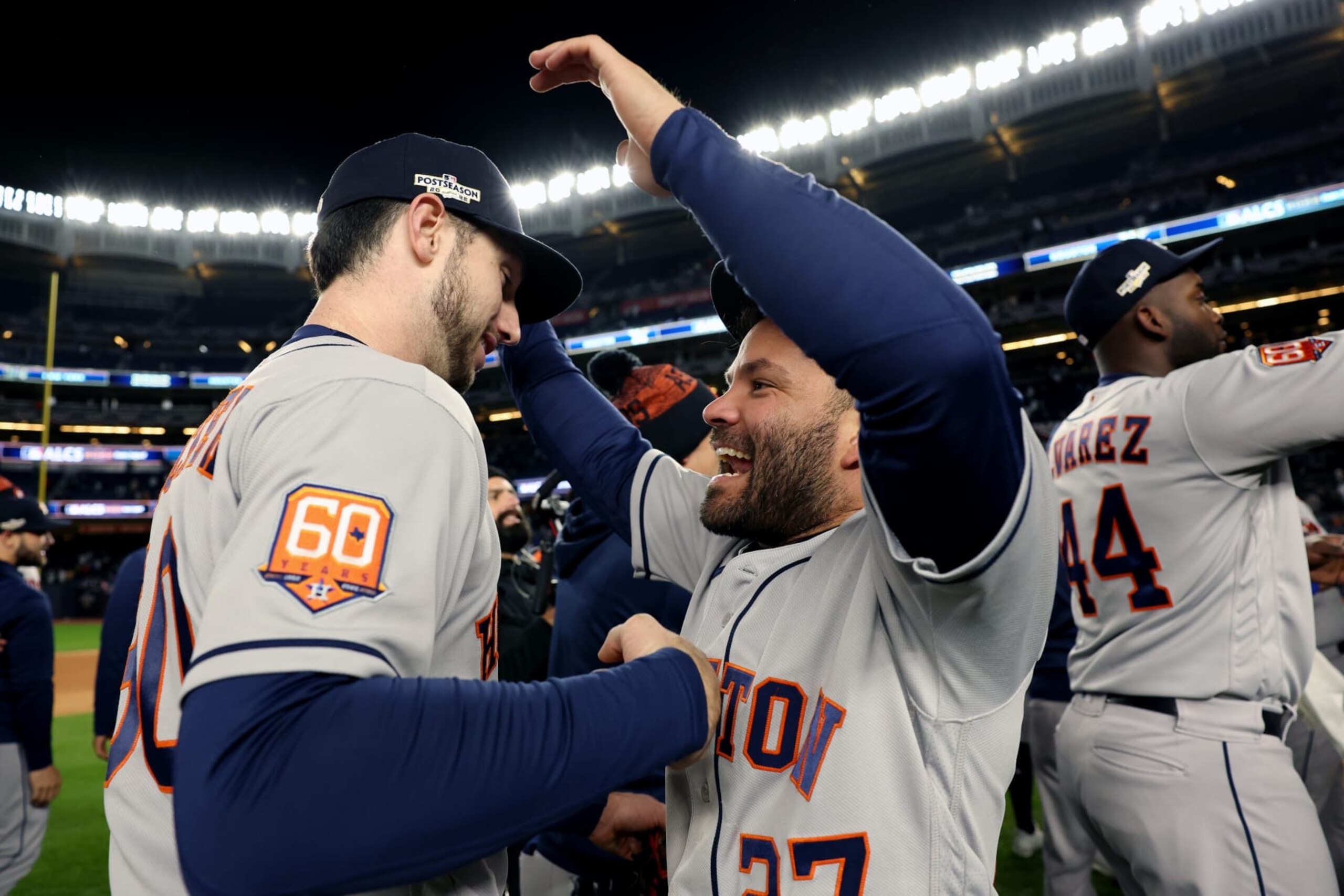 NEW YORK, NY - OCTOBER 23:   Kyle Tucker #30 and Jose Altuve #27 of the Houston Astros celebrate on the field after Astros defeated the New York Yankees in Game 4 of the ALCS at Yankee Stadium on Sunday, October 23, 2022 in New York, New York. (Photo by Mary DeCicco/MLB Photos via Getty Images)