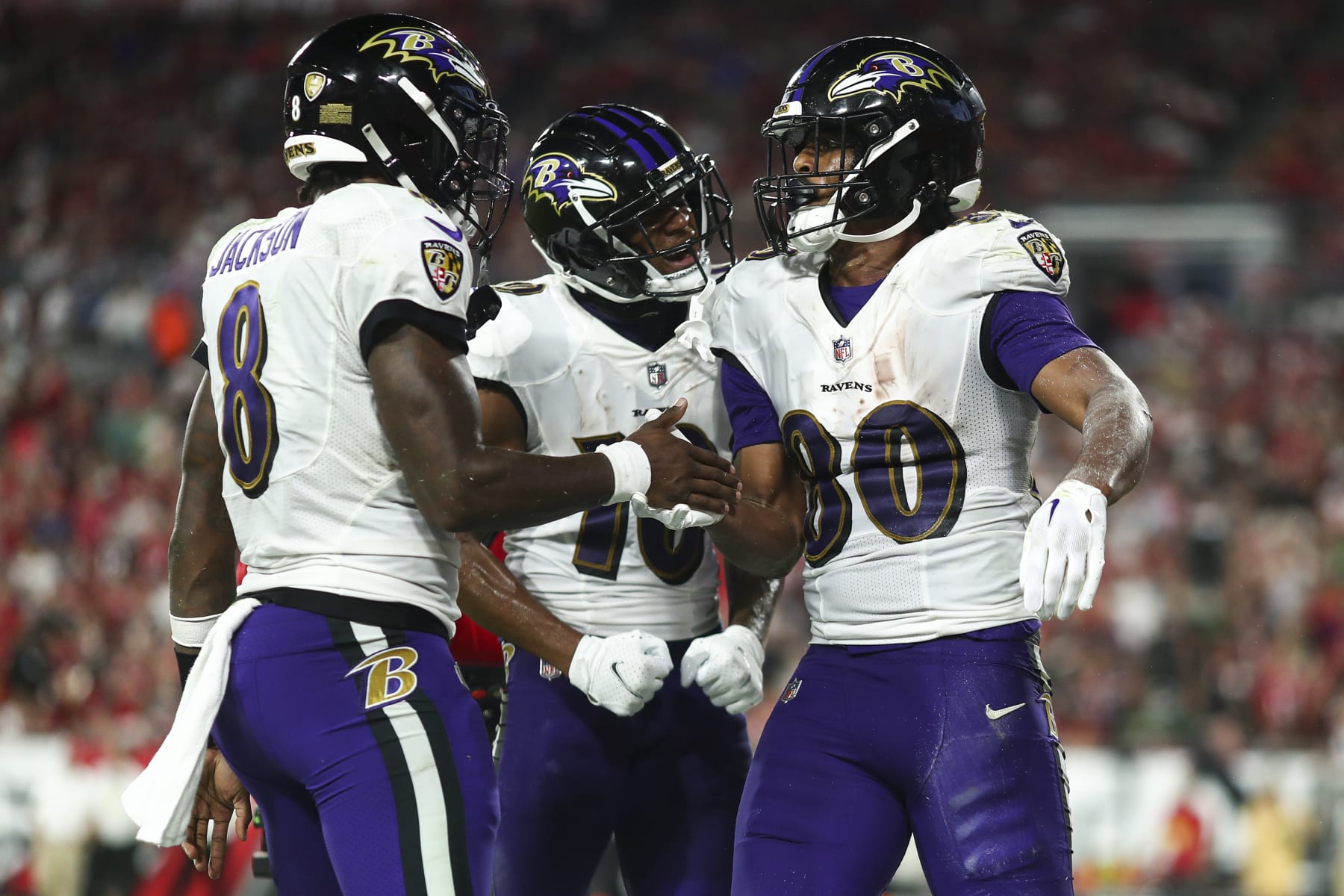 TAMPA, FL - OCTOBER 27: Isaiah Likely #80 of the Baltimore Ravens celebrates with Demarcus Robinson #10 and Lamar Jackson #8 after scoring a touchdown during the third quarter of an NFL football game against the Tampa Bay Buccaneers at Raymond James Stadium on October 27, 2022 in Tampa, Florida. (Photo by Kevin Sabitus/Getty Images)