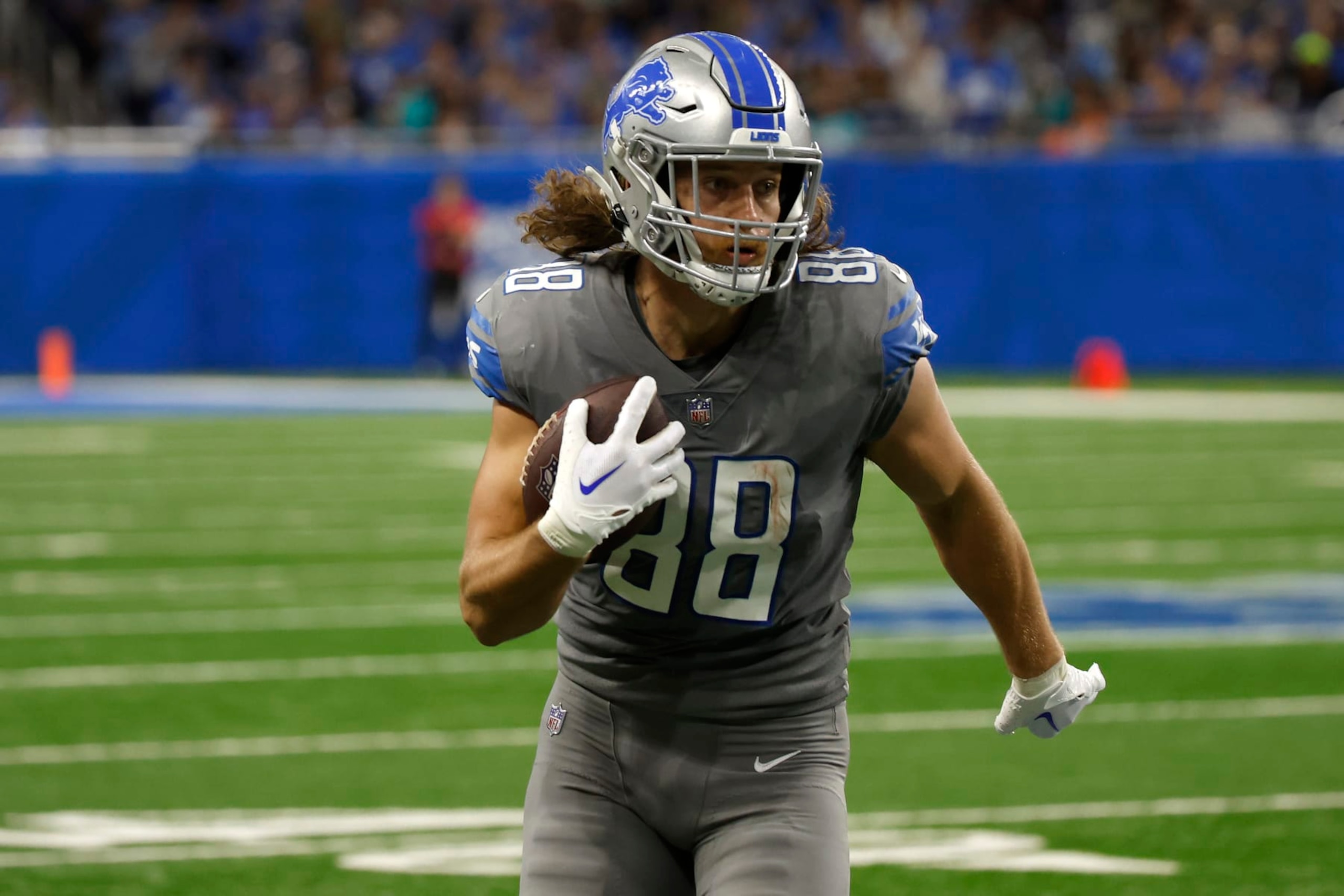DETROIT, MICHIGAN - OCTOBER 30: T.J. Hockenson #88 of the Detroit Lions runs for a first down during the second quarter against the Miami Dolphins at Ford Field on October 30, 2022 in Detroit, Michigan. (Photo by Leon Halip/Getty Images) DETROIT, MICHIGAN - OCTOBER 30: T.J. Hockenson #88 of the Detroit Lions runs for a first down during the second quarter against the Miami Dolphins at Ford Field on October 30, 2022 in Detroit, Michigan. (Photo by Leon Halip/Getty Images)