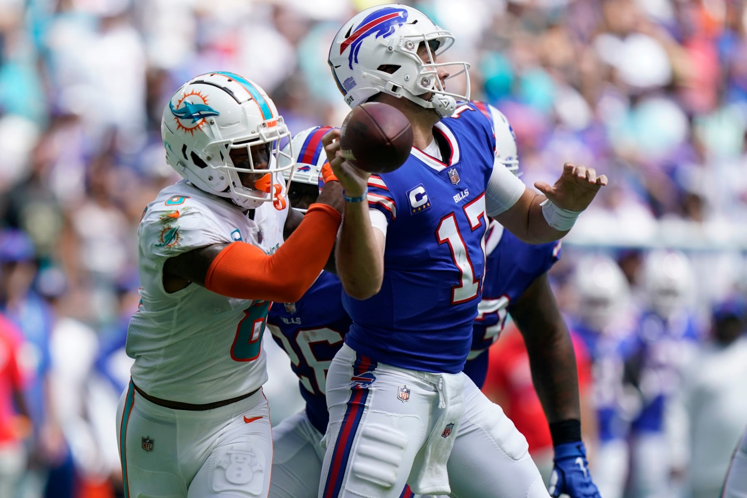 Safety Jevon Holland and quarterback Josh Allen 