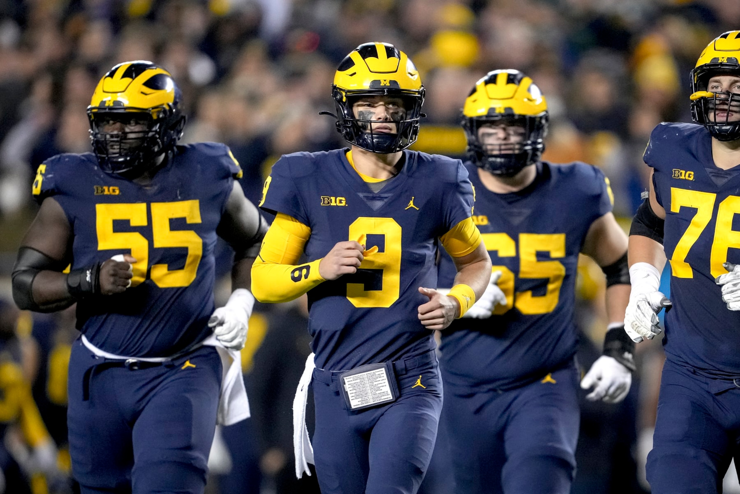 ANN ARBOR, MICHIGAN - OCTOBER 29: J.J. McCarthy #9 of the Michigan Wolverines leads his team out to the field against the Michigan State Spartans at Michigan Stadium on October 29, 2022 in Ann Arbor, Michigan. (Photo by Nic Antaya/Getty Images) ANN ARBOR, MICHIGAN - OCTOBER 29: J.J. McCarthy #9 of the Michigan Wolverines leads his team out to the field against the Michigan State Spartans at Michigan Stadium on October 29, 2022 in Ann Arbor, Michigan. (Photo by Nic Antaya/Getty Images)