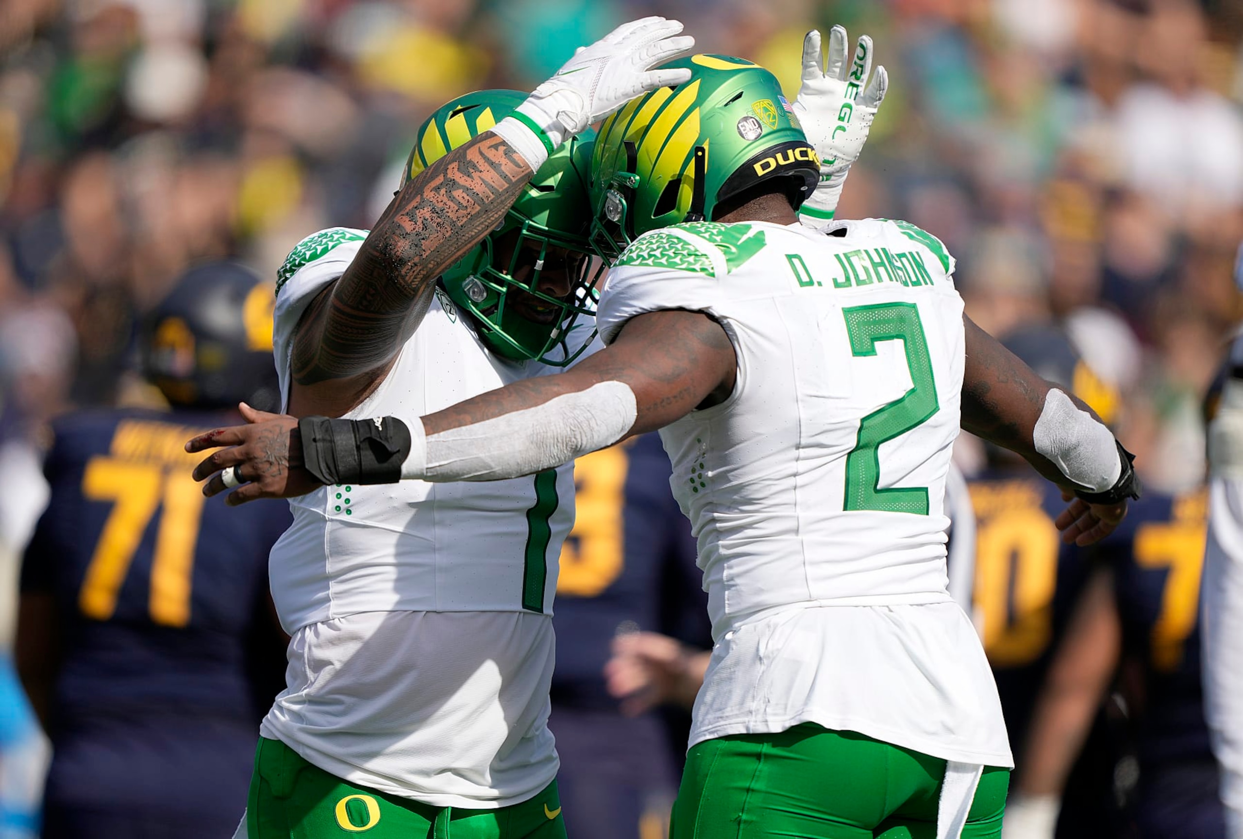 BERKELEY, CALIFORNIA - OCTOBER 29: Noah Sewell #1 and DJ Johnson #2 of the Oregon Ducks celebrates after they sacked the California Golden Bears quarterback during the second quarter of an NCAA football at FTX Field at California Memorial Stadium on October 29, 2022 in Berkeley, California. (Photo by Thearon W. Henderson/Getty Images) BERKELEY, CALIFORNIA - OCTOBER 29: Noah Sewell #1 and DJ Johnson #2 of the Oregon Ducks celebrates after they sacked the California Golden Bears quarterback during the second quarter of an NCAA football at FTX Field at California Memorial Stadium on October 29, 2022 in Berkeley, California. (Photo by Thearon W. Henderson/Getty Images)
