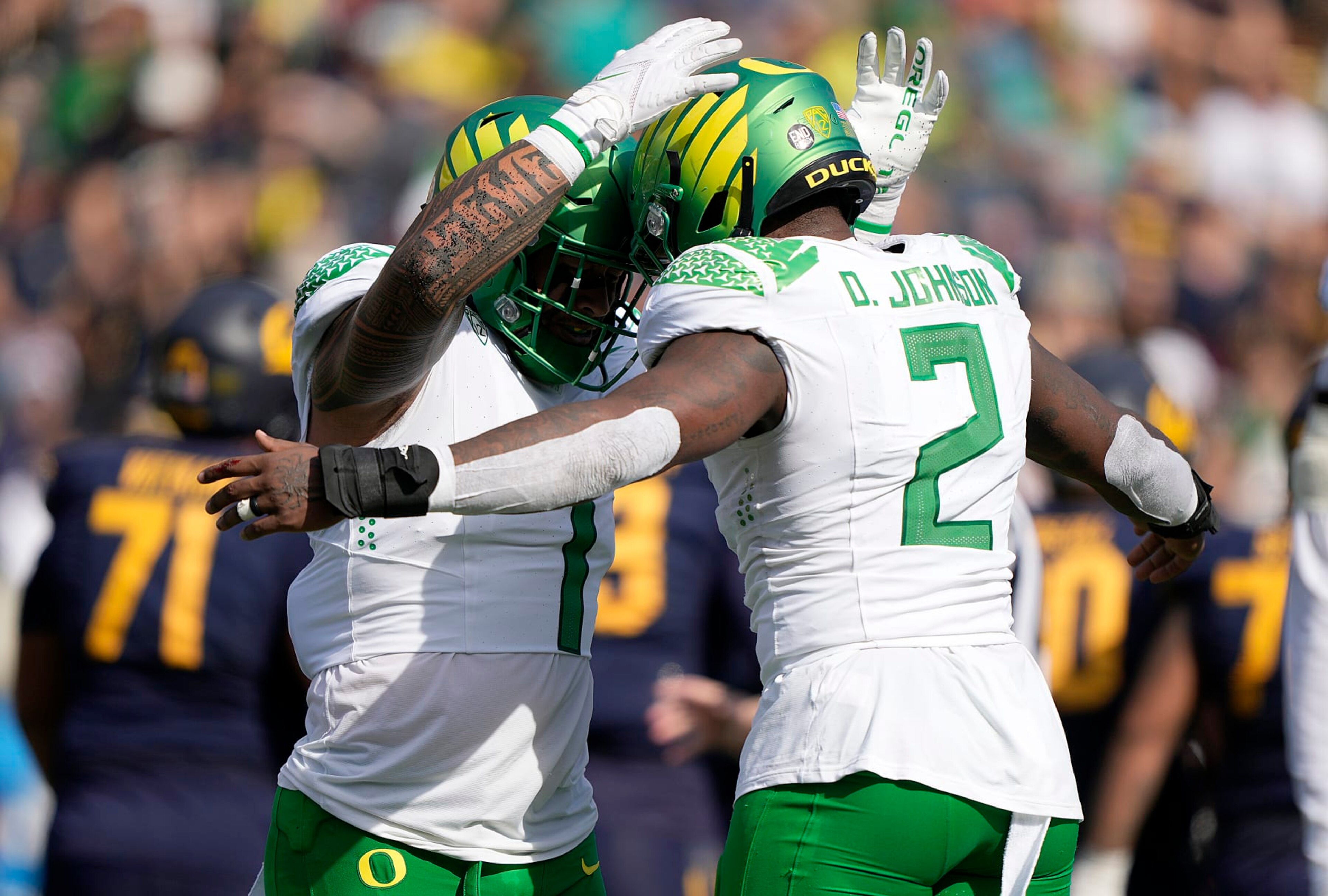BERKELEY, CALIFORNIA - OCTOBER 29: Noah Sewell #1 and DJ Johnson #2 of the Oregon Ducks celebrates after they sacked the California Golden Bears quarterback during the second quarter of an NCAA football at FTX Field at California Memorial Stadium on October 29, 2022 in Berkeley, California. (Photo by Thearon W. Henderson/Getty Images)