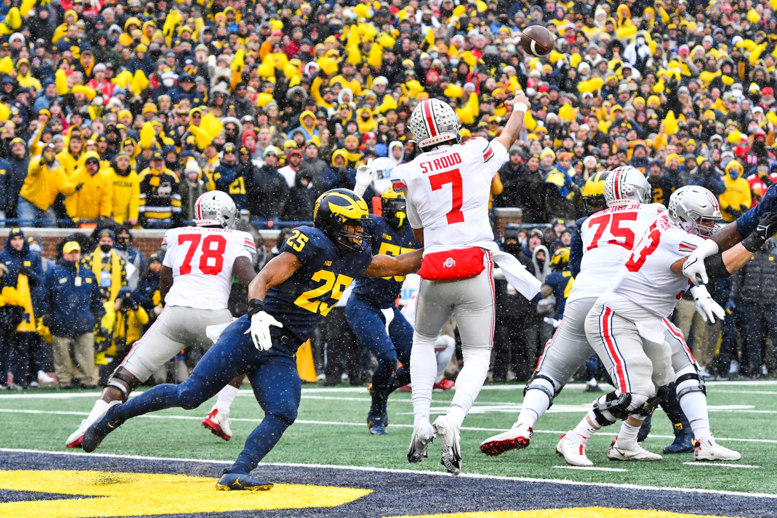 ANN ARBOR, MI - NOVEMBER 27: Ohio State Buckeyes quarterback C.J. Stroud (7) just gets away a pass before Michigan Wolverines linebacker Joey Velazquez (29) can get to him during The Michigan Wolverines vs the Ohio State Buckeyes game on Saturday November 27, 2021 at Michigan Stadium in Ann Arbor, MI. (Photo by Steven King/Icon Sportswire via Getty Images) ANN ARBOR, MI - NOVEMBER 27: Ohio State Buckeyes quarterback C.J. Stroud (7) just gets away a pass before Michigan Wolverines linebacker Joey Velazquez (29) can get to him during The Michigan Wolverines vs the Ohio State Buckeyes game on Saturday November 27, 2021 at Michigan Stadium in Ann Arbor, MI. (Photo by Steven King/Icon Sportswire via Getty Images)