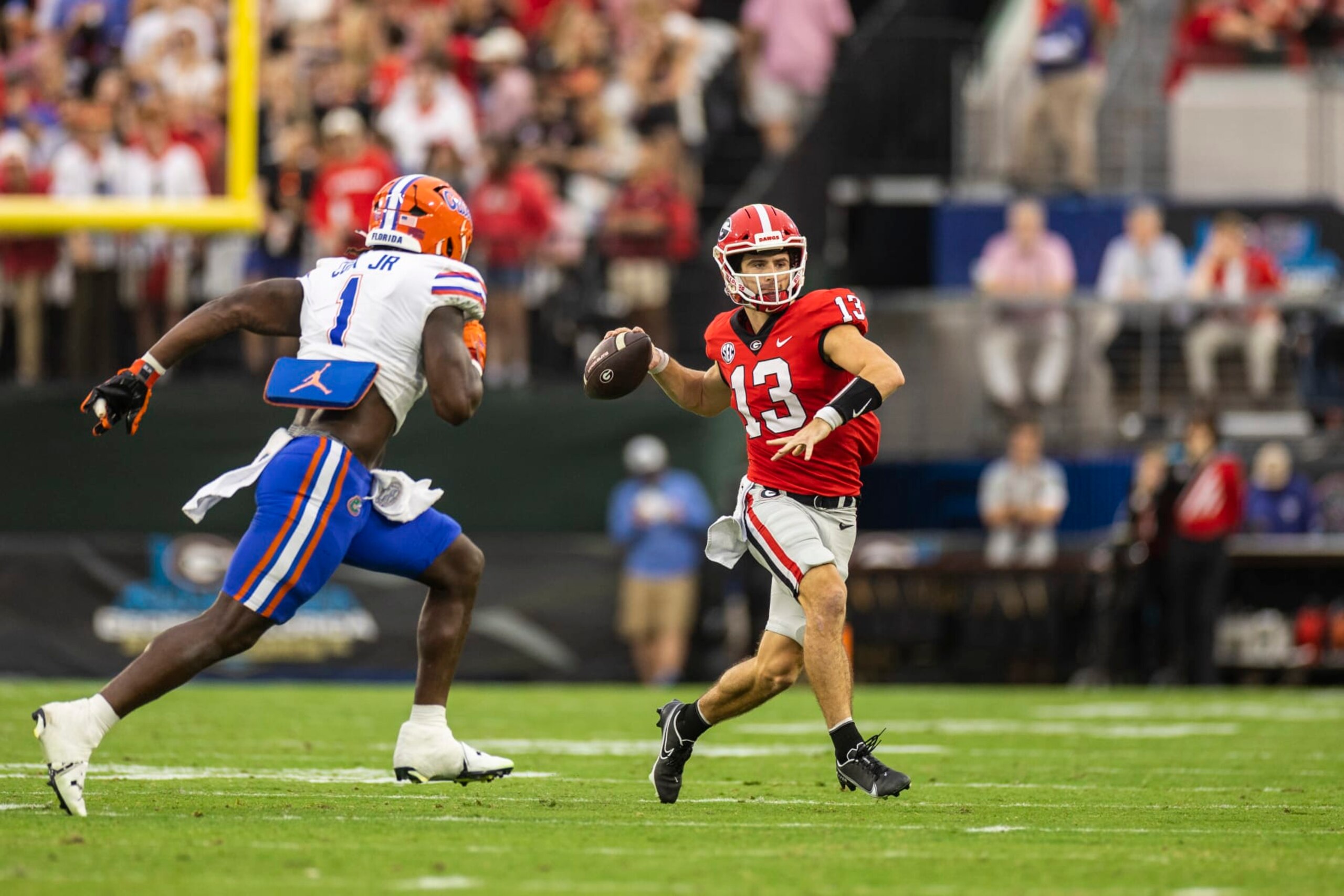 JACKSONVILLE, FLORIDA - OCTOBER 29: Stetson Bennett #13 of the Georgia Bulldogs looks to pass during the first half of a game against Brenton Cox Jr. #1 of the Florida Gators at TIAA Bank Field on October 29, 2022 in Jacksonville, Florida. (Photo by James Gilbert/Getty Images) JACKSONVILLE, FLORIDA - OCTOBER 29: Stetson Bennett #13 of the Georgia Bulldogs looks to pass during the first half of a game against Brenton Cox Jr. #1 of the Florida Gators at TIAA Bank Field on October 29, 2022 in Jacksonville, Florida. (Photo by James Gilbert/Getty Images)