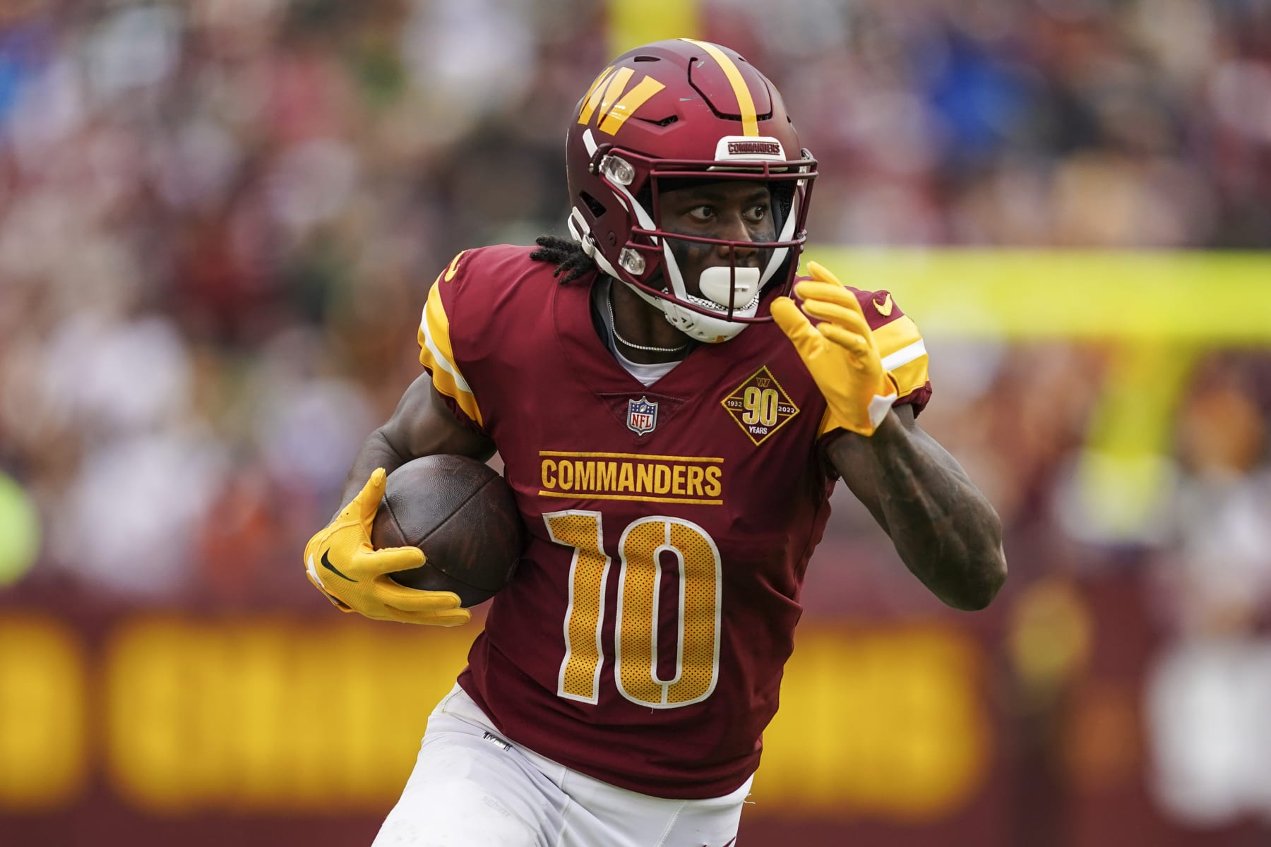 Washington Commanders wide receiver Curtis Samuel (10) runs with the ball during the second half of an NFL football game against the Green Bay Packers, Sunday, Oct. 23, 2022, in Landover, Md. (AP Photo/Al Drago)