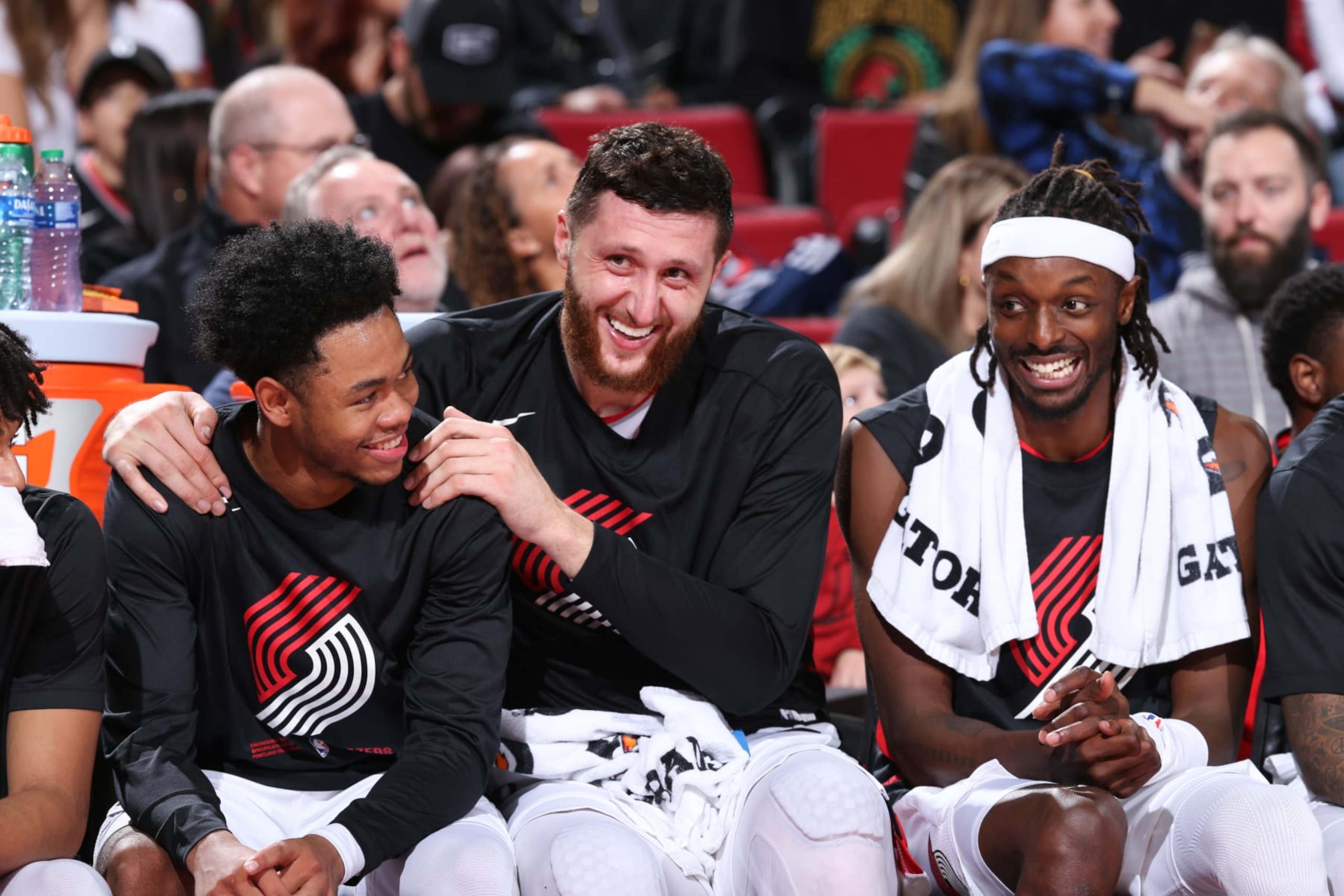 PORTLAND, OR - OCTOBER 24: Anfernee Simons #1, Jusuf Nurkic #27, and Jerami Grant #9 of the Portland Trail Blazers smile during the game against the Denver Nuggets on October 24, 2022 at the Moda Center Arena in Portland, Oregon. NOTE TO USER: User expressly acknowledges and agrees that, by downloading and or using this photograph, user is consenting to the terms and conditions of the Getty Images License Agreement. Mandatory Copyright Notice: Copyright 2022 NBAE (Photo by Sam Forencich/NBAE via Getty Images)