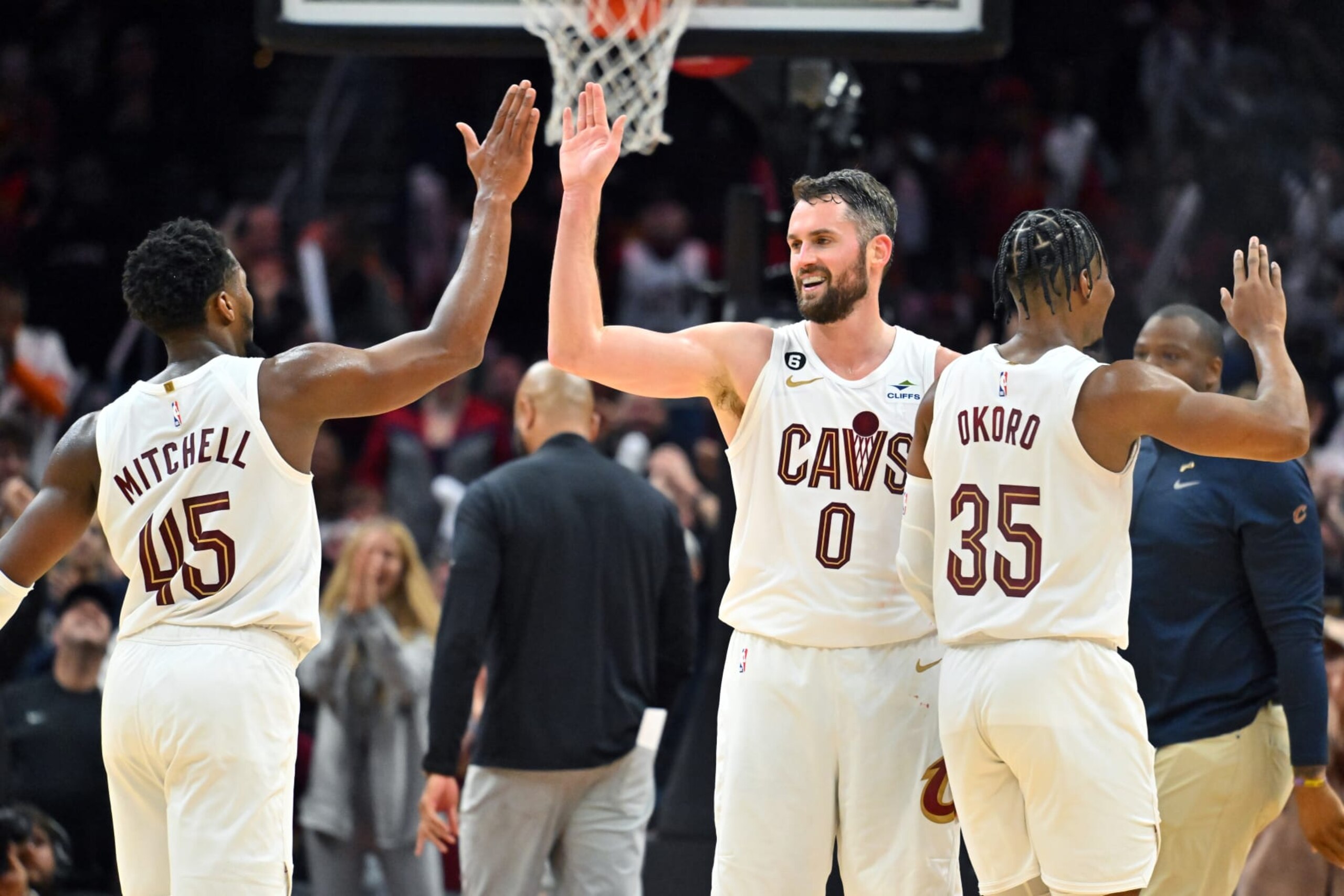 CLEVELAND, OHIO - OCTOBER 30: Donovan Mitchell #45 Kevin Love #0 and Isaac Okoro #35 of the Cleveland Cavaliers celebrate during the fourth quarter of the game against the New York Knicks at Rocket Mortgage Fieldhouse on October 30, 2022 in Cleveland, Ohio. The Cavaliers defeated the Knicks 121-108. NOTE TO USER: User expressly acknowledges and agrees that, by downloading and or using this photograph, User is consenting to the terms and conditions of the Getty Images License Agreement. (Photo by Jason Miller/Getty Images)