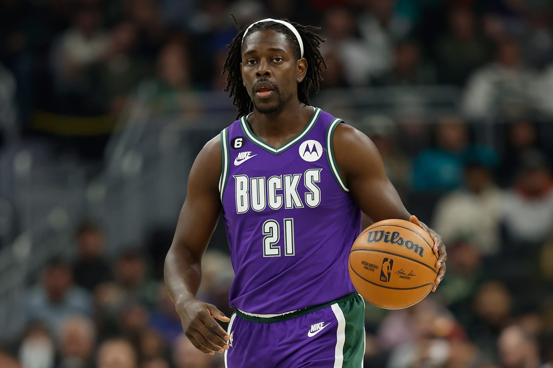 MILWAUKEE, WISCONSIN - OCTOBER 28: Jrue Holiday #21 of the Milwaukee Bucks dribbles the basketball up court during the first half of the game against the New York Knicks at Fiserv Forum on October 28, 2022 in Milwaukee, Wisconsin. NOTE TO USER: User expressly acknowledges and agrees that, by downloading and or using this photograph, User is consenting to the terms and conditions of the Getty Images License Agreement. (Photo by John Fisher/Getty Images)