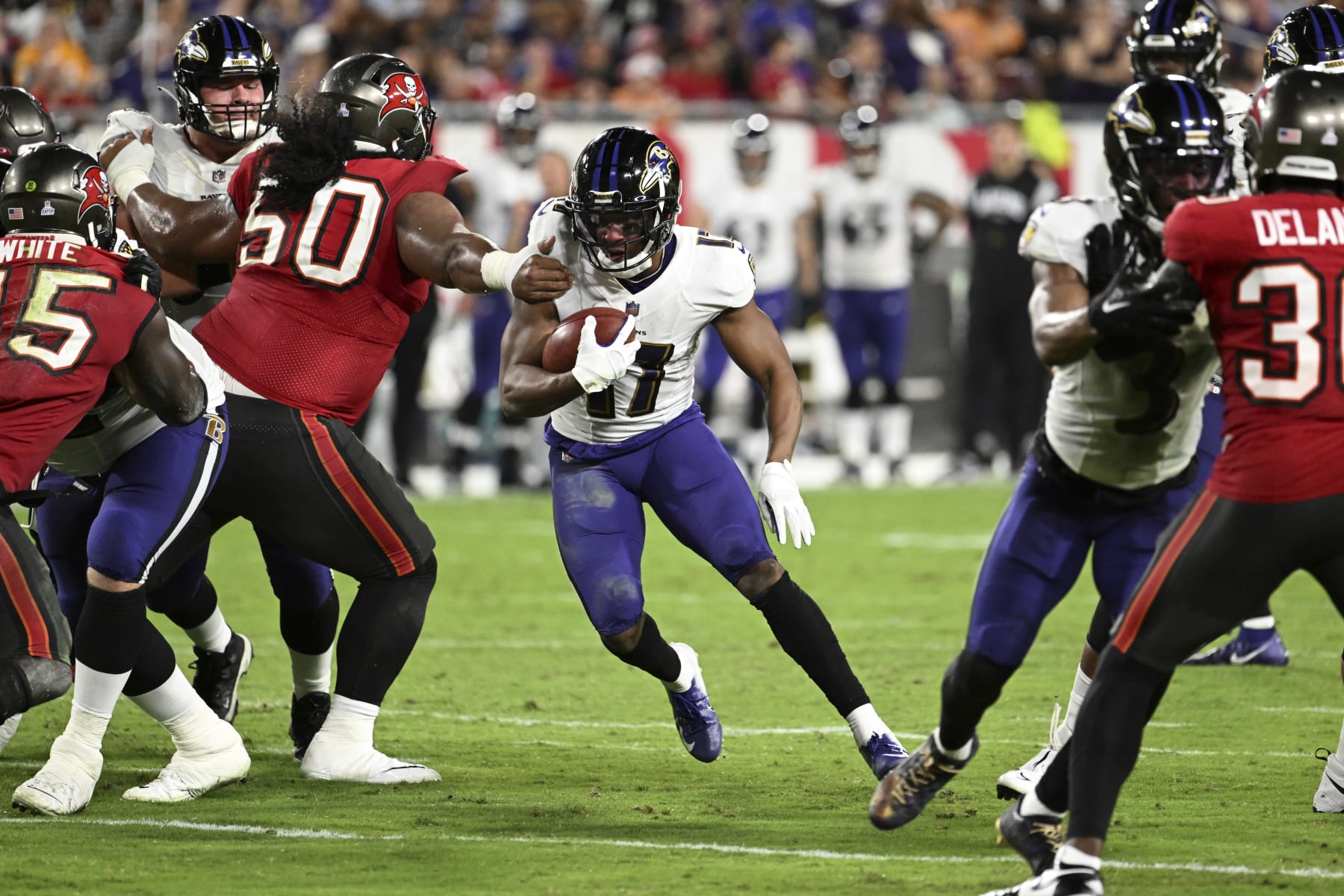 Baltimore Ravens running back Kenyan Drake runs with the ball during the second half of an NFL football game against the Tampa Bay Buccaneers Thursday, Oct. 27, 2022, in Tampa, Fla. (AP Photo/Jason Behnken)