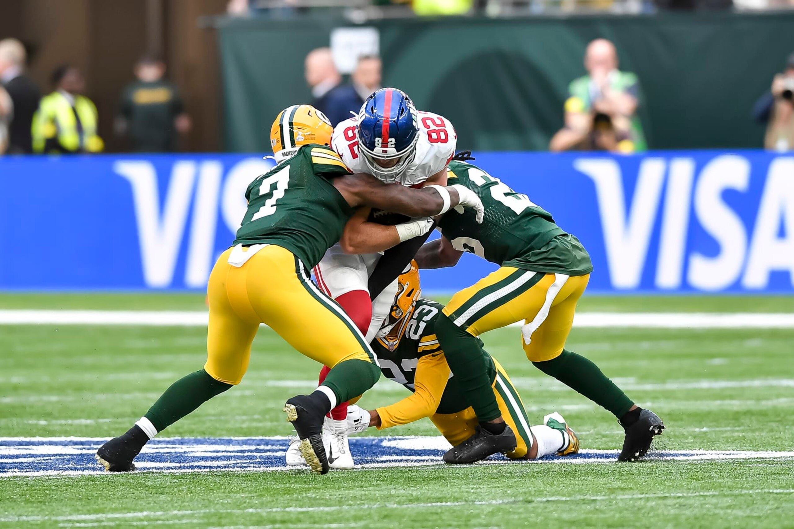 LONDON, ENGLAND - OCTOBER 09: Quay Walker of Green Bay Packers, Daniel Bellinger of New York Giants, Jaire Alexander of Green Bay Packers and AJ Dillon of Green Bay Packers with a tackle during battle for the ball during the NFL match between New York Giants and Green Bay Packers at Tottenham Hotspur Stadium on October 9, 2022 in London, England. (Photo by Vincent Mignott/DeFodi Images via Getty Images) LONDON, ENGLAND - OCTOBER 09: Quay Walker of Green Bay Packers, Daniel Bellinger of New York Giants, Jaire Alexander of Green Bay Packers and AJ Dillon of Green Bay Packers with a tackle during battle for the ball during the NFL match between New York Giants and Green Bay Packers at Tottenham Hotspur Stadium on October 9, 2022 in London, England. (Photo by Vincent Mignott/DeFodi Images via Getty Images)