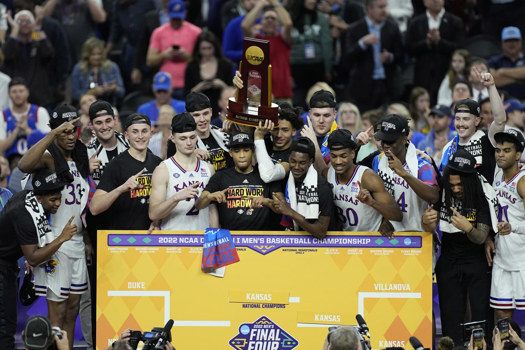 Kansas players celebrate during the second half of a college basketball game in the finals of the Men's Final Four NCAA tournament, Monday, April 4, 2022, in New Orleans. Kansas won 72-69. (AP Photo/Gerald Herbert)