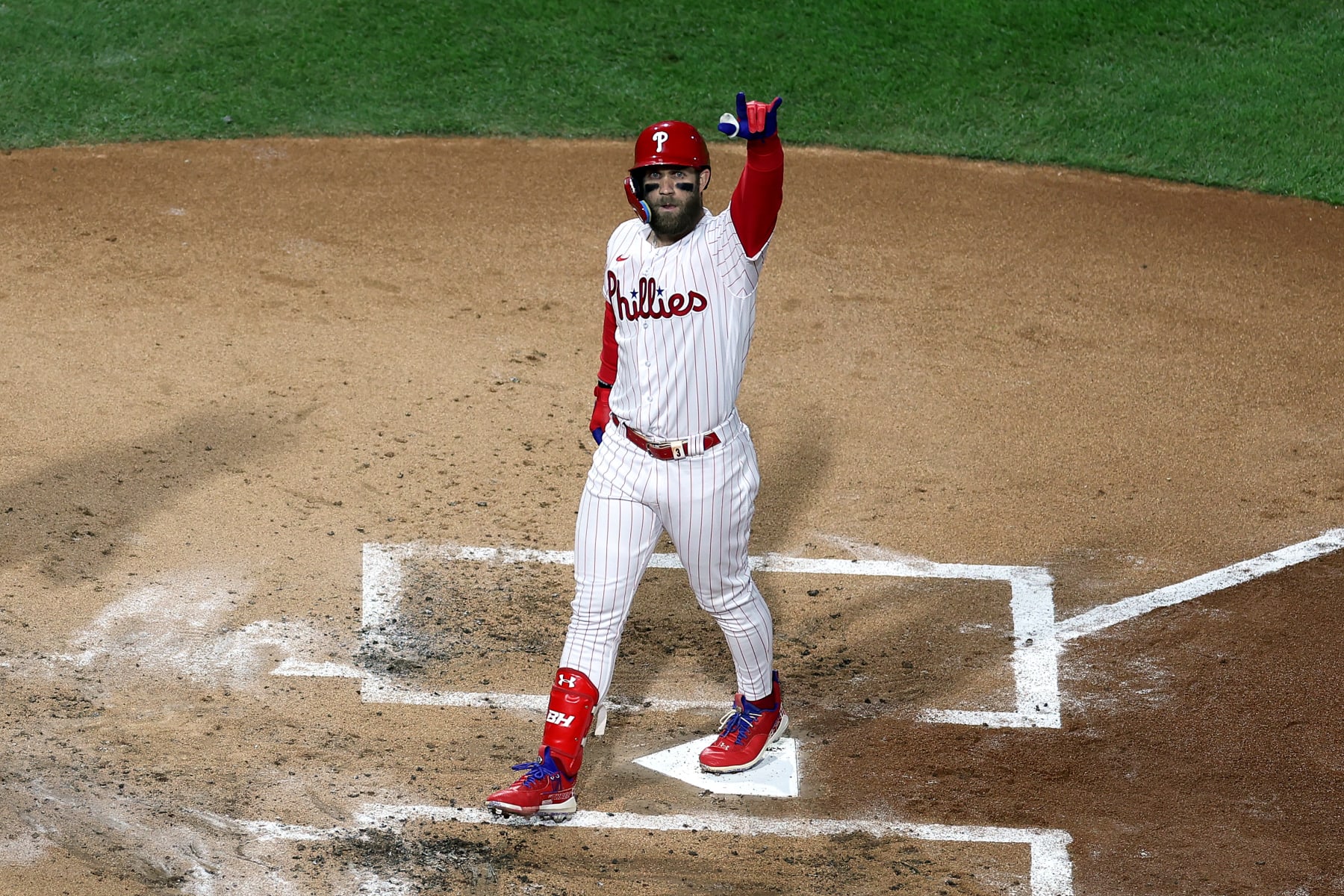 PHILADELPHIA, PENNSYLVANIA - NOVEMBER 01: Bryce Harper #3 of the Philadelphia Phillies celebrates after hitting a two-run home run against the Houston Astros during the first inning in Game Three of the 2022 World Series at Citizens Bank Park on November 01, 2022 in Philadelphia, Pennsylvania. (Photo by Al Bello/Getty Images)