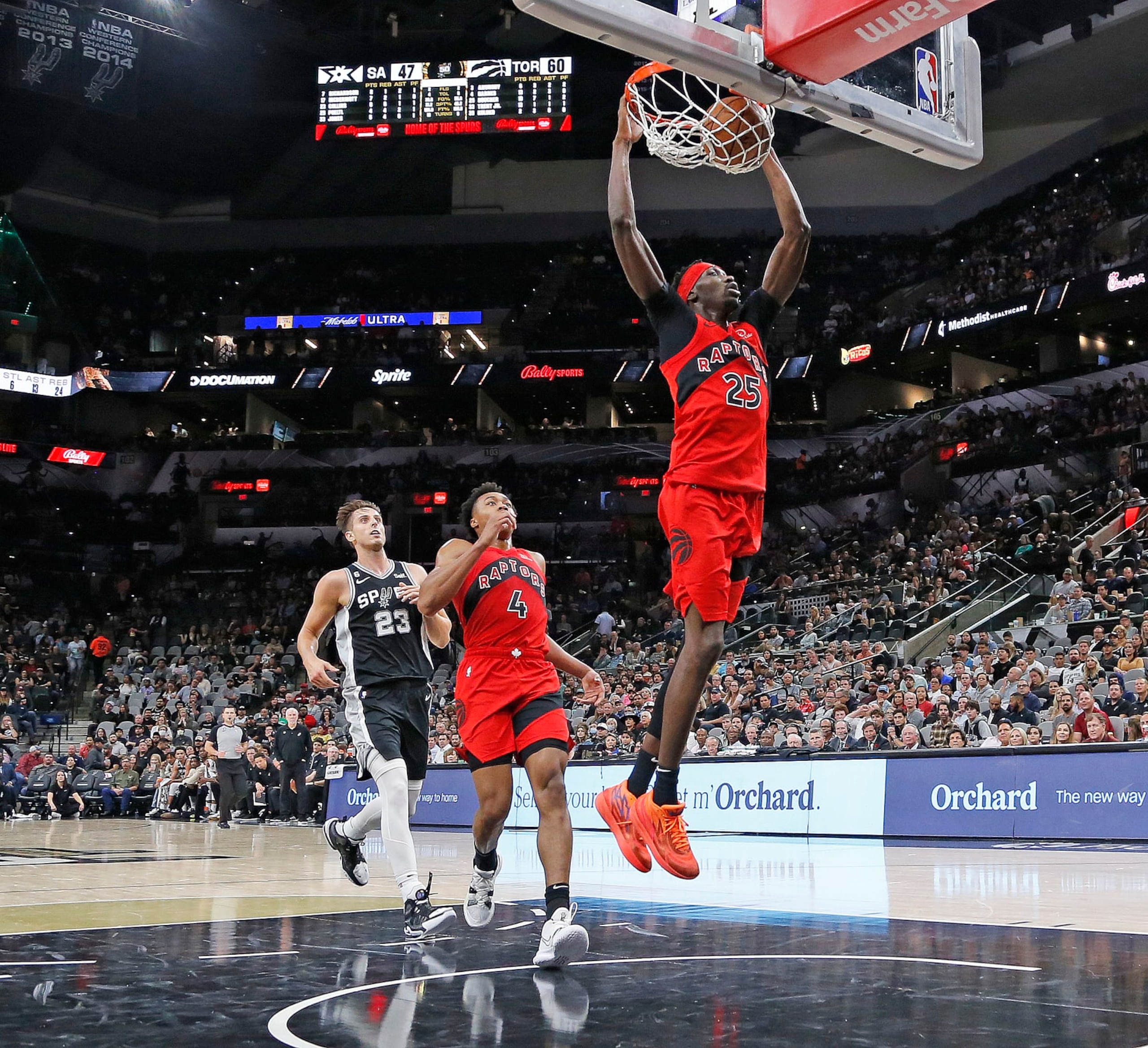 SAN ANTONIO, TX - NOVEMBER 02: Chris Boucher #25 of the Toronto Raptors dunks against the San Antonio Spurs in the first half at AT&T Center on November 02, 2022 in San Antonio, Texas. NOTE TO USER: User expressly acknowledges and agrees that, by downloading and or using this photograph, User is consenting to terms and conditions of the Getty Images License Agreement. (Photo by Ronald Cortes/Getty Images) SAN ANTONIO, TX - NOVEMBER 02: Chris Boucher #25 of the Toronto Raptors dunks against the San Antonio Spurs in the first half at AT&T Center on November 02, 2022 in San Antonio, Texas. NOTE TO USER: User expressly acknowledges and agrees that, by downloading and or using this photograph, User is consenting to terms and conditions of the Getty Images License Agreement. (Photo by Ronald Cortes/Getty Images)