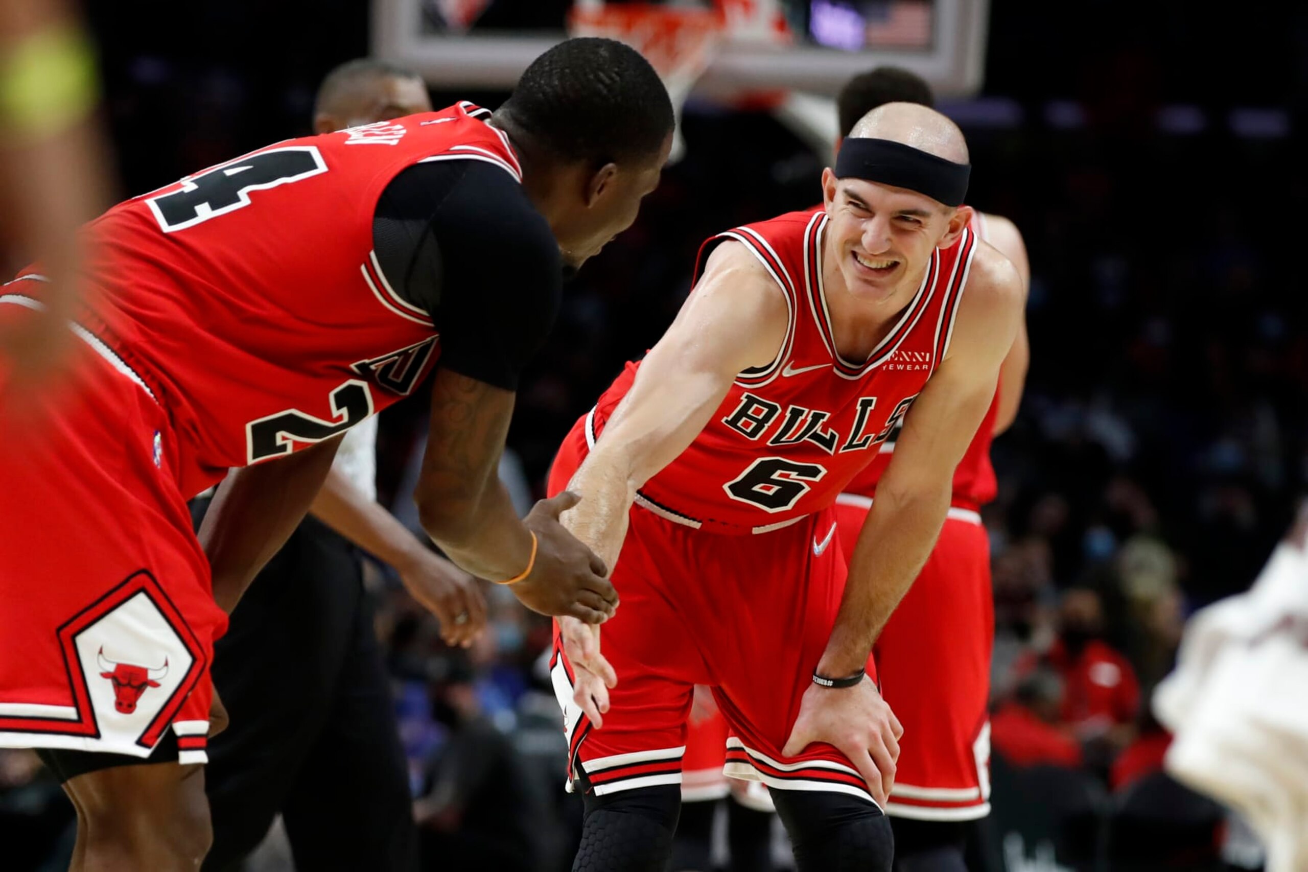 Chicago Bulls guard Alex Caruso, right, celebrates with forward Javonte Green during the second half of an NBA basketball game, as the Bulls defeat the Los Angeles Clippers 100-90, Sunday, Nov. 14, 2021, in Los Angeles. (AP Photo/Alex Gallardo)