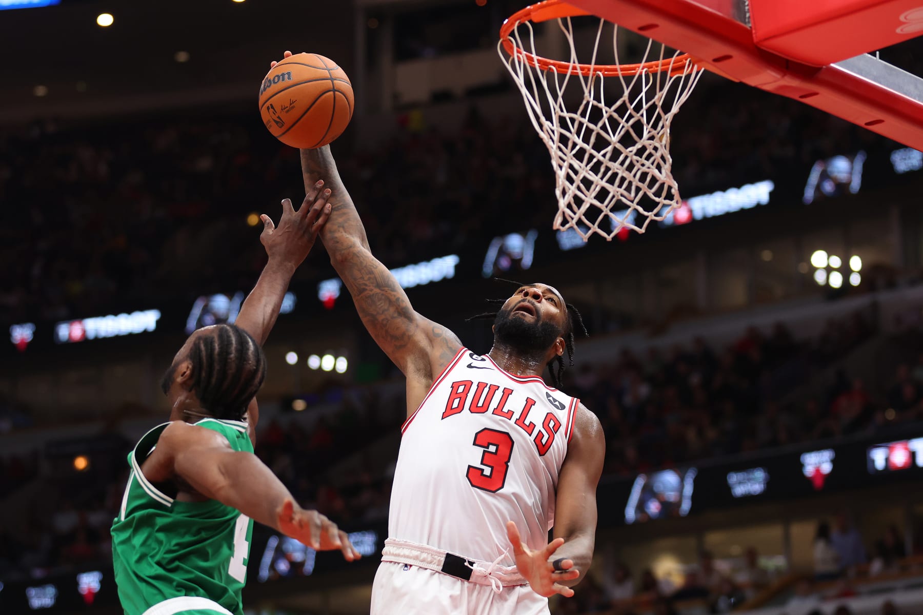 CHICAGO, ILLINOIS - OCTOBER 24: Andre Drummond #3 of the Chicago Bulls is fouled by Noah Vonleh #4 of the Boston Celtics during the second half at United Center on October 24, 2022 in Chicago, Illinois. NOTE TO USER: User expressly acknowledges and agrees that, by downloading and or using this photograph, User is consenting to the terms and conditions of the Getty Images License Agreement. (Photo by Michael Reaves/Getty Images)