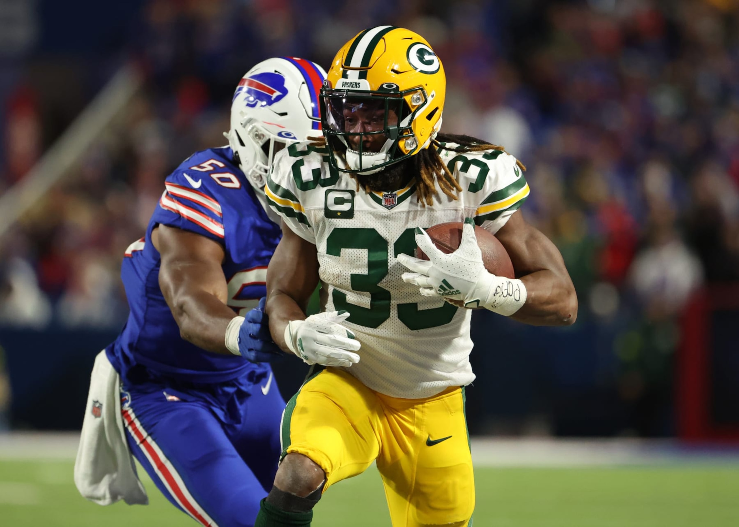 ORCHARD PARK, NEW YORK - OCTOBER 30: Aaron Jones #33 of the Green Bay Packers rushes during the third quarter against the Buffalo Bills at Highmark Stadium on October 30, 2022 in Orchard Park, New York. (Photo by Timothy T Ludwig/Getty Images) ORCHARD PARK, NEW YORK - OCTOBER 30: Aaron Jones #33 of the Green Bay Packers rushes during the third quarter against the Buffalo Bills at Highmark Stadium on October 30, 2022 in Orchard Park, New York. (Photo by Timothy T Ludwig/Getty Images)