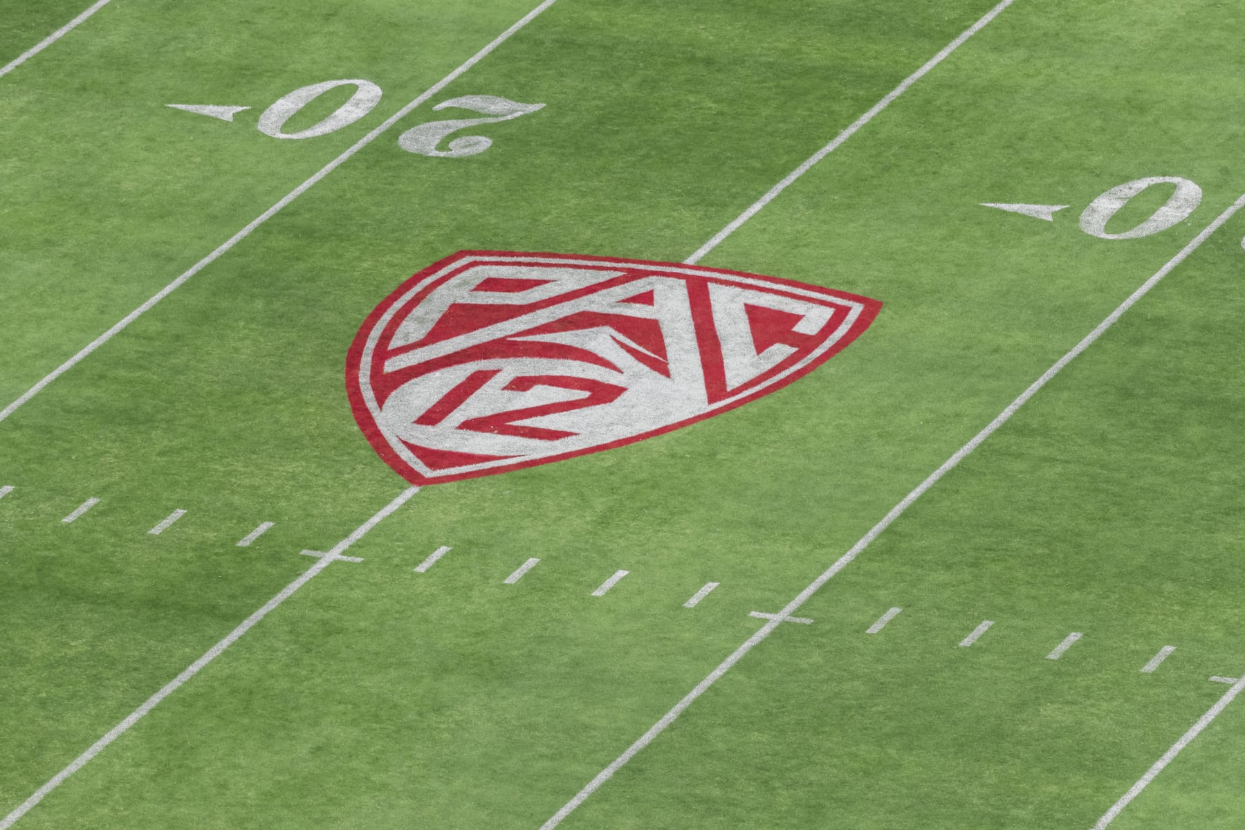 PALO ALTO, CA - SEPTEMBER 26:  A high angle view of the Pac-12 logo on the field at Stanford Stadium during an NCAA Pac-12 college football game between the Stanford Cardinal and the UCLA Bruins on September 26, 2021 in Palo Alto, California.  (Photo by David Madison/Getty Images)