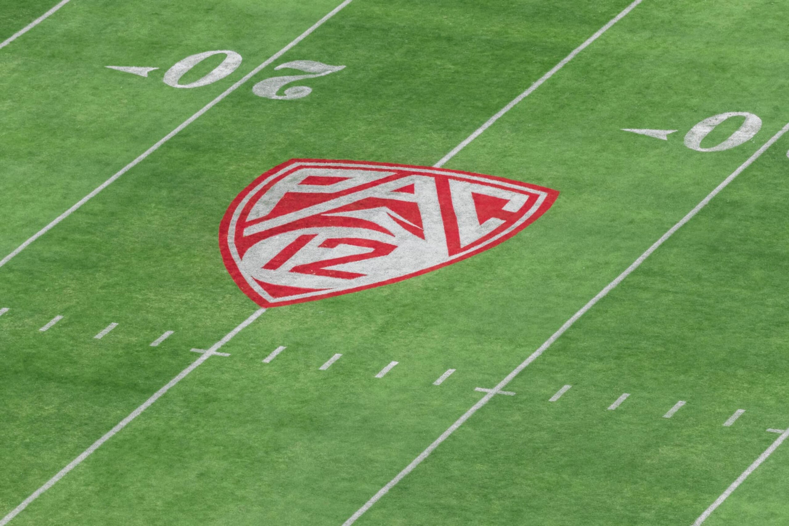 PALO ALTO, CA - SEPTEMBER 26: A high angle view of the Pac-12 logo on the field at Stanford Stadium during an NCAA Pac-12 college football game between the Stanford Cardinal and the UCLA Bruins on September 26, 2021 in Palo Alto, California. (Photo by David Madison/Getty Images) PALO ALTO, CA - SEPTEMBER 26: A high angle view of the Pac-12 logo on the field at Stanford Stadium during an NCAA Pac-12 college football game between the Stanford Cardinal and the UCLA Bruins on September 26, 2021 in Palo Alto, California. (Photo by David Madison/Getty Images)