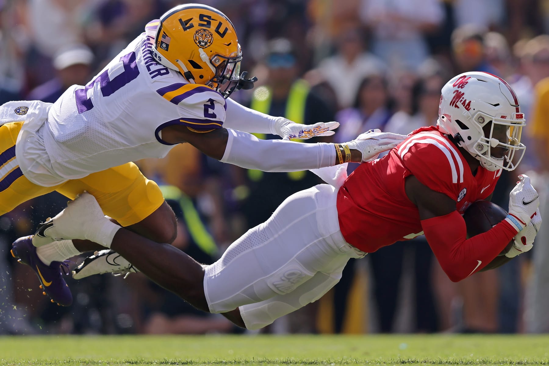Ole Miss' Jonathan Mingo dives for a catch against LSU.