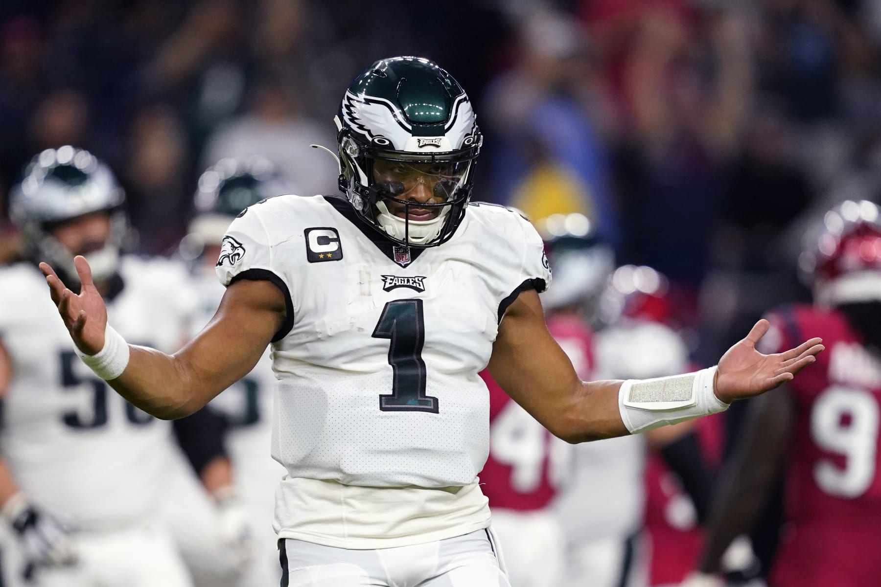 Philadelphia Eagles quarterback Jalen Hurts (1) celebrates after a touchdown by running back Miles Sanders in the first half of an NFL football game against the Houston Texans in Houston, Thursday, Nov. 3, 2022. (AP Photo/Tony Gutierrez)