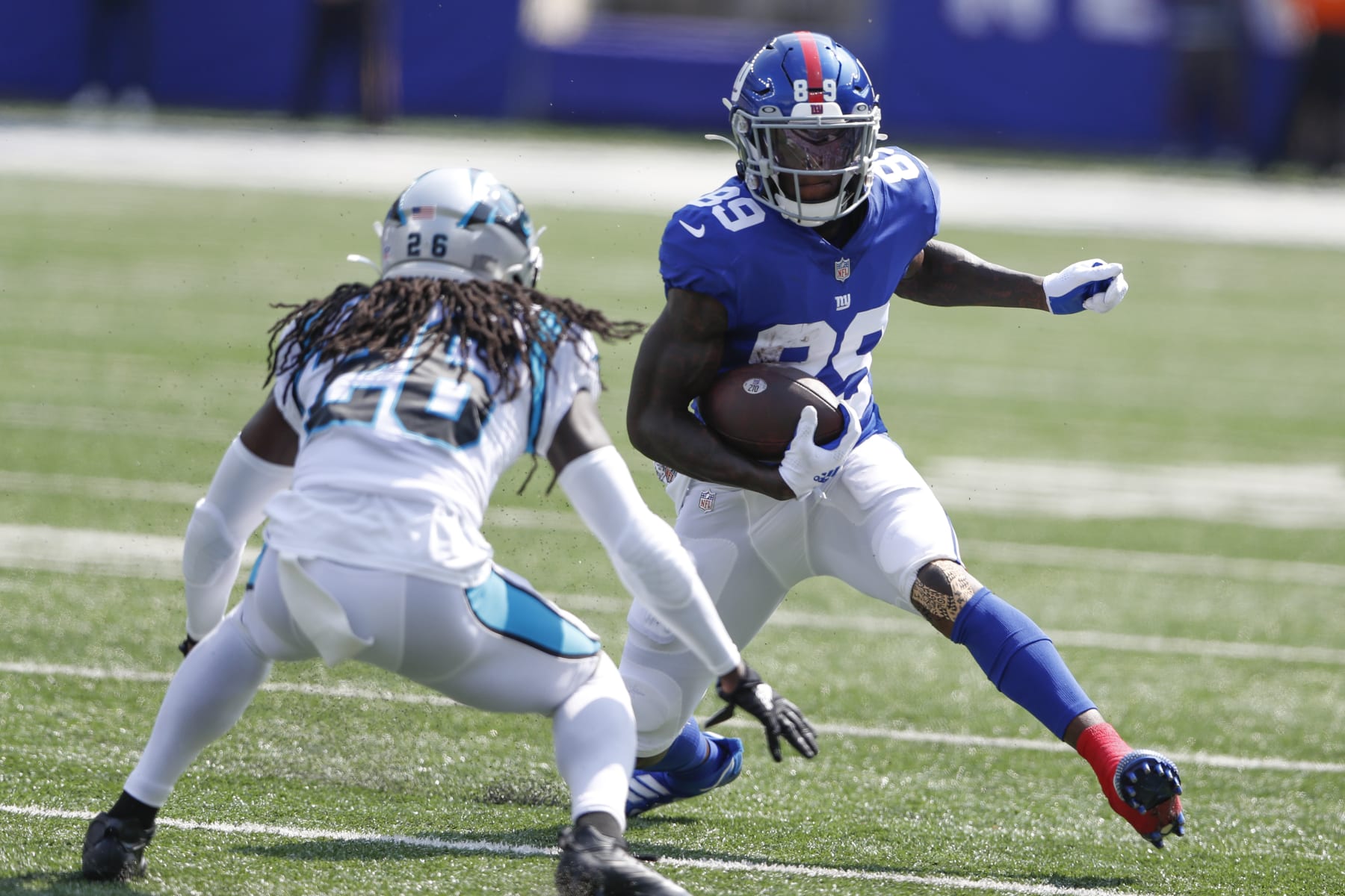 New York Giants' Kadarius Toney, right, runs with the ball during the first half an NFL football game against the Carolina Panthers, Sunday, Sept. 18, 2022, in East Rutherford, N.J. (AP Photo/Noah K. Murray)