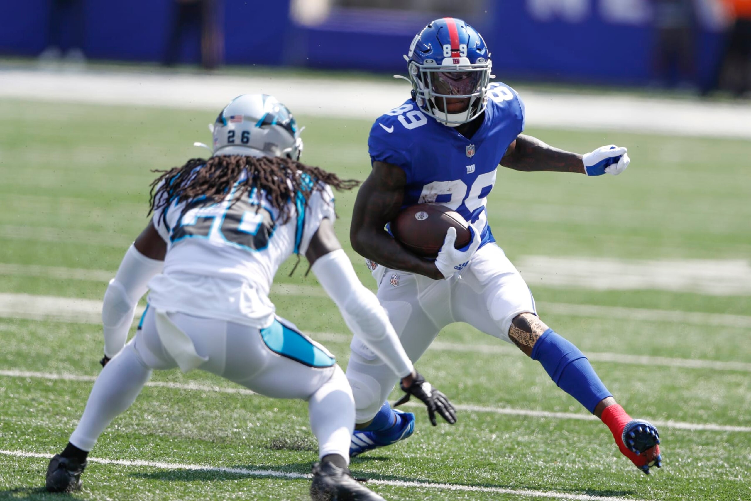 New York Giants' Kadarius Toney, right, runs with the ball during the first half an NFL football game against the Carolina Panthers, Sunday, Sept. 18, 2022, in East Rutherford, N.J. (AP Photo/Noah K. Murray) New York Giants' Kadarius Toney, right, runs with the ball during the first half an NFL football game against the Carolina Panthers, Sunday, Sept. 18, 2022, in East Rutherford, N.J. (AP Photo/Noah K. Murray)