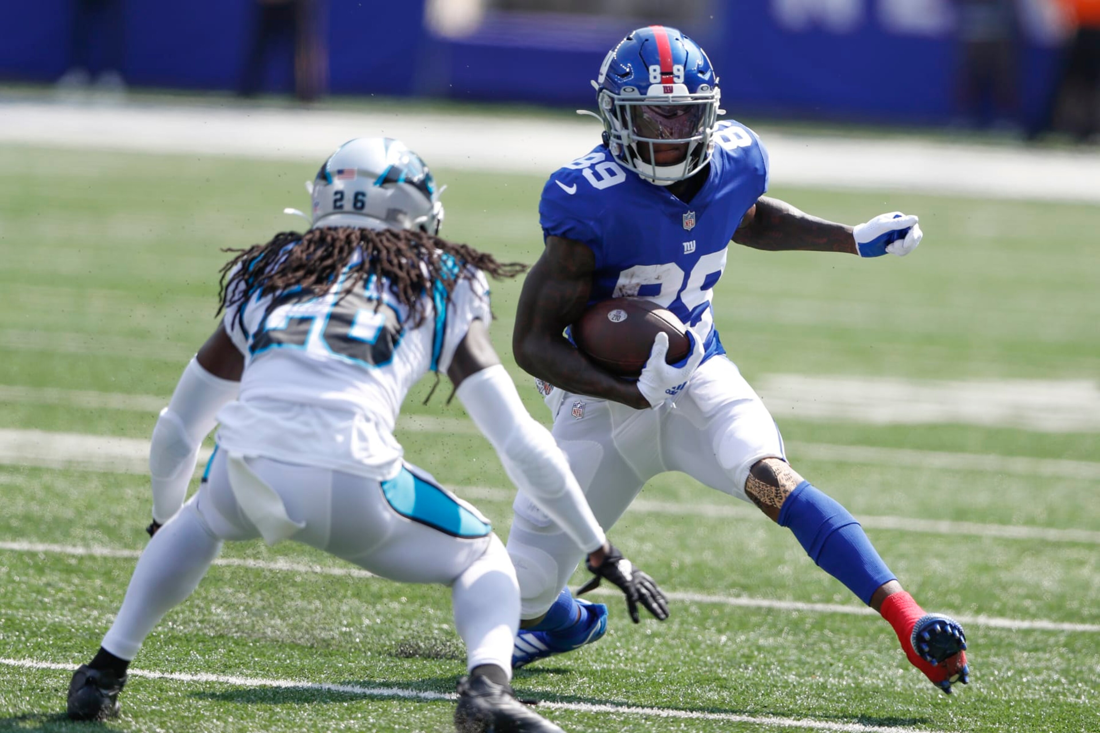 New York Giants' Kadarius Toney, right, runs with the ball during the first half an NFL football game against the Carolina Panthers, Sunday, Sept. 18, 2022, in East Rutherford, N.J. (AP Photo/Noah K. Murray)