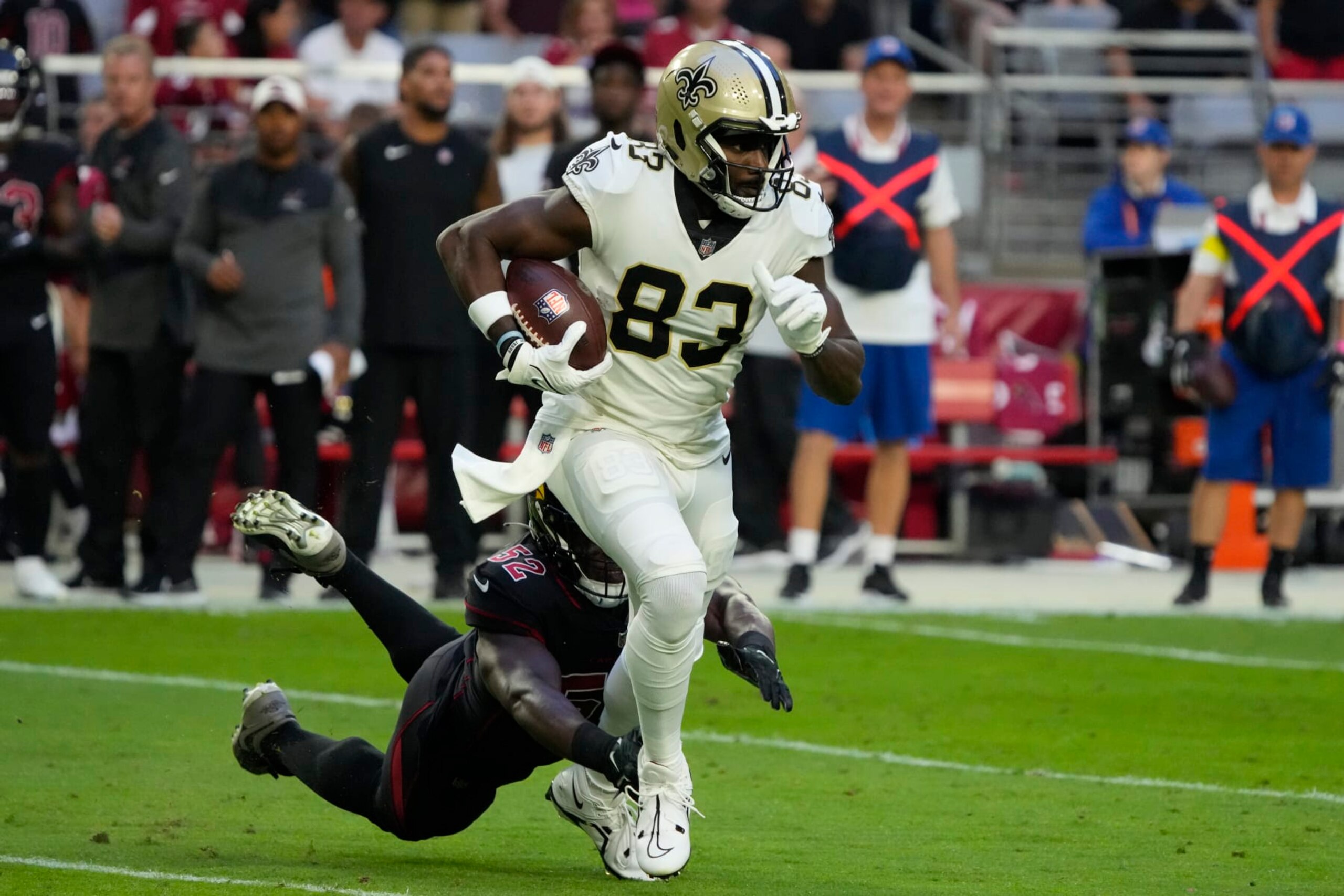 New Orleans Saints tight end Juwan Johnson (83) runs the ball against the Arizona Cardinals during the second half of an NFL football game, Thursday, Oct. 20, 2022, in Glendale, Ariz. (AP Photo/Rick Scuteri) New Orleans Saints tight end Juwan Johnson (83) runs the ball against the Arizona Cardinals during the second half of an NFL football game, Thursday, Oct. 20, 2022, in Glendale, Ariz. (AP Photo/Rick Scuteri)