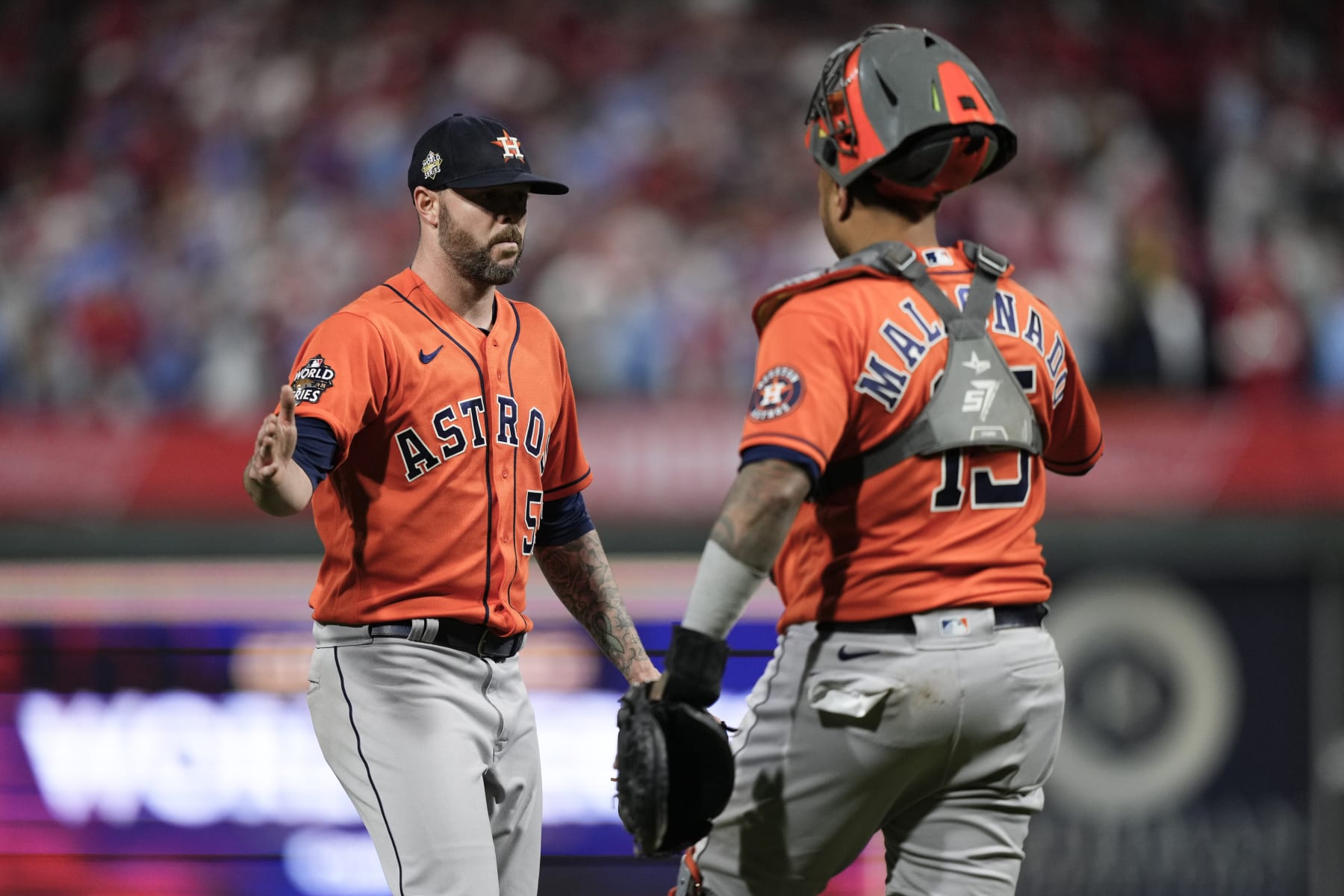 Houston Astros relief pitcher Ryan Pressly and catcher Martin Maldonado celebrate their win in Game 5 of baseball's World Series between the Houston Astros and the Philadelphia Phillies on Friday, Nov. 4, 2022, in Philadelphia. The Astros won 3-2, to take a one game lead in the best of seven series. (AP Photo/Matt Slocum)