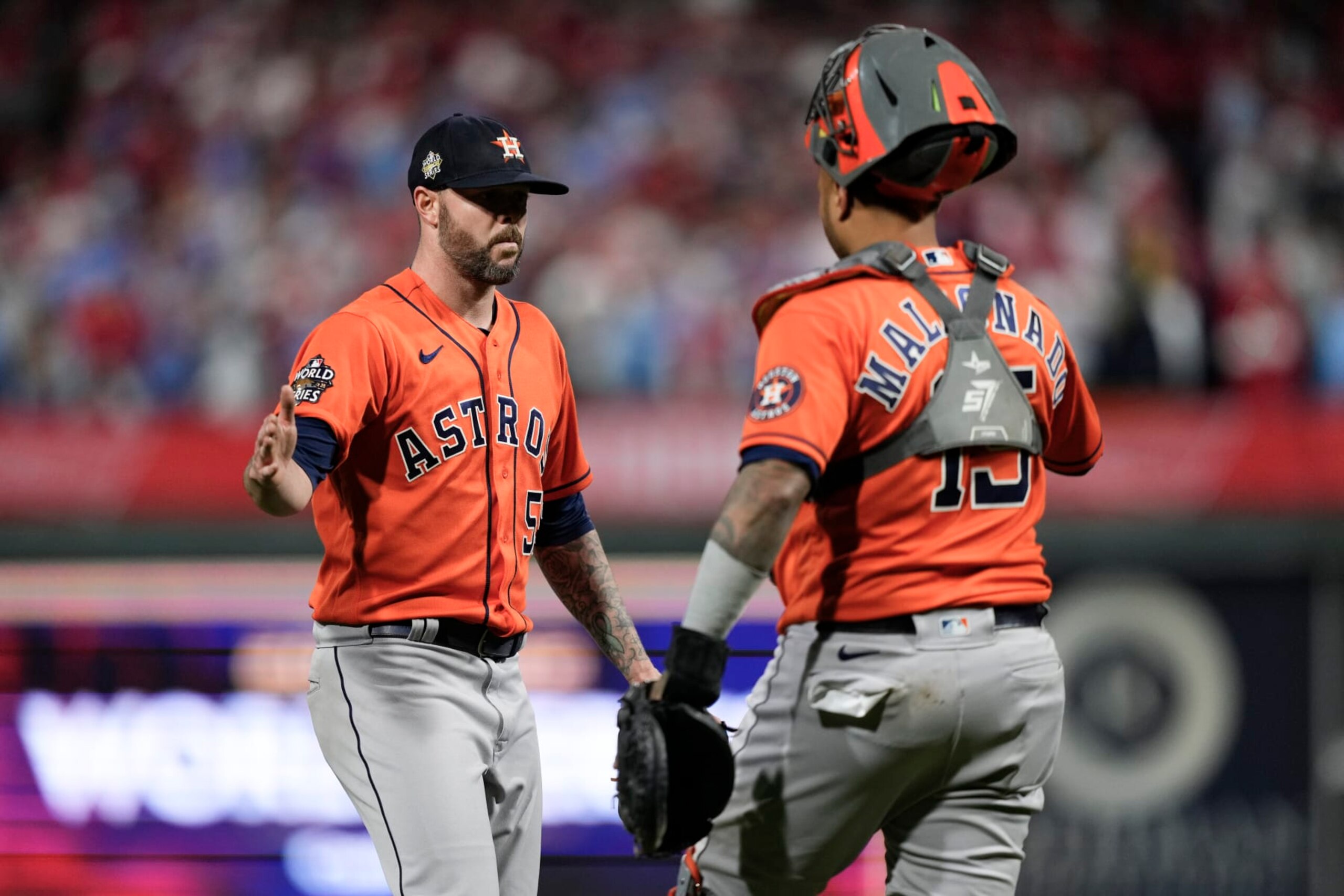 Houston Astros relief pitcher Ryan Pressly and catcher Martin Maldonado celebrate their win in Game 5 of baseball's World Series between the Houston Astros and the Philadelphia Phillies on Friday, Nov. 4, 2022, in Philadelphia. The Astros won 3-2, to take a one game lead in the best of seven series. (AP Photo/Matt Slocum)