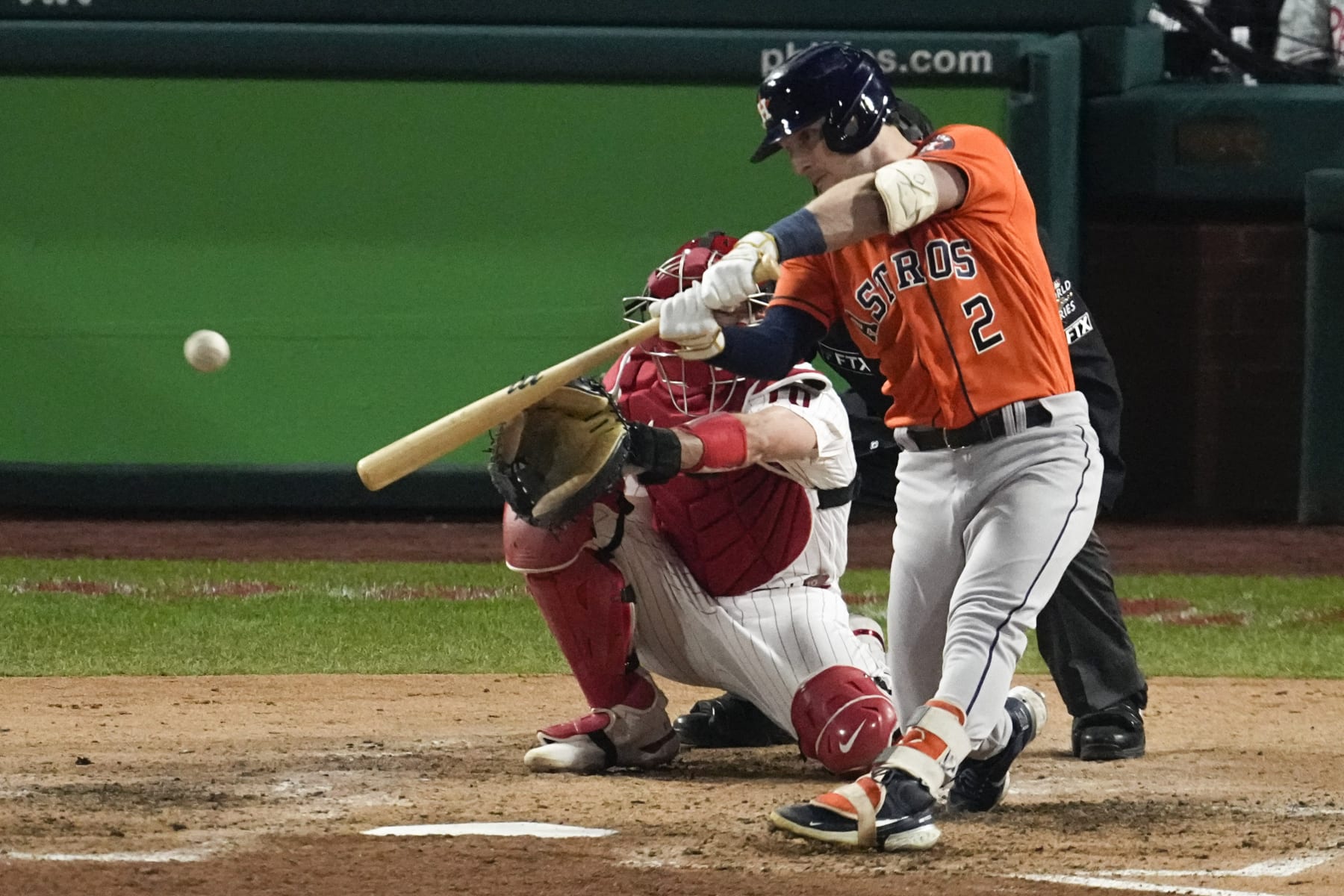 Houston Astros' Alex Bregman hits a two-RBI double during the fifth inning in Game 4 of baseball's World Series between the Houston Astros and the Philadelphia Phillies on Wednesday, Nov. 2, 2022, in Philadelphia. (AP Photo/Matt Rourke)
